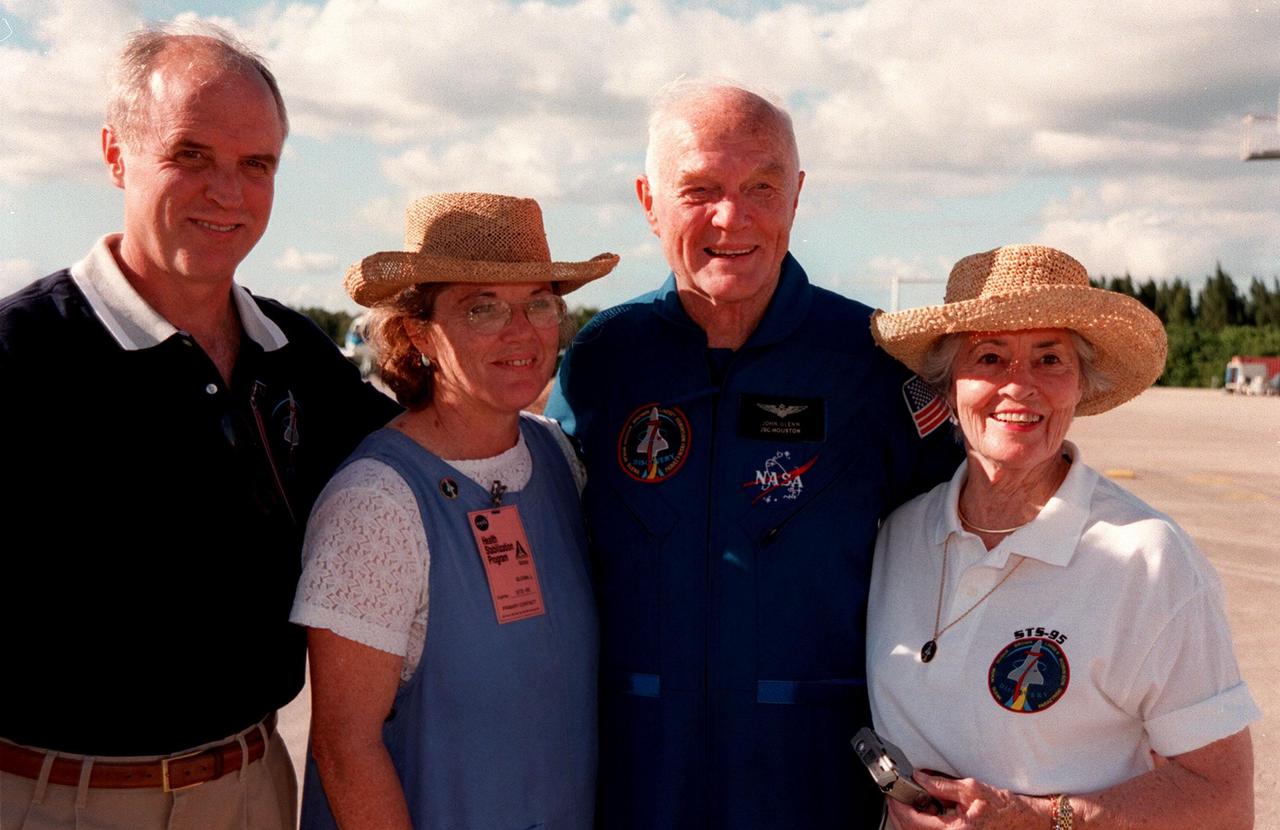 STS-95 Payload Specialist John H. Glenn Jr. (second from right), senator from Ohio, poses (left to right) with his son, David, daughter, Lyn, and (far right) his wife, Annie, after landing at Kennedy Space Center's Shuttle Landing Facility aboard a T-38 jet. Glenn and other crewmembers flew into KSC to make final preparations for launch. Targeted for liftoff at 2 p.m. on Oct. 29, the STS-95 mission includes research payloads such as the Spartan solar-observing deployable spacecraft, the Hubble Space Telescope Orbital Systems Test Platform, the International Extreme Ultraviolet Hitchhiker, as well as the SPACEHAB single module with experiments on space flight and the aging process. The mission is expected to last 8 days, 21 hours and 49 minutes, and return to KSC on Nov. 7. The other STS-95 crew members are Mission Commander Curtis L. Brown Jr., Pilot Steven W. Lindsey, Mission Specialist Scott E. Parazynski, Mission Specialist Stephen K. Robinson, Mission Specialist Pedro Duque, with the European Space Agency (ESA), and Payload Specialist Chiaki Mukai, with the National Space Development Agency of Japan (NASDA)