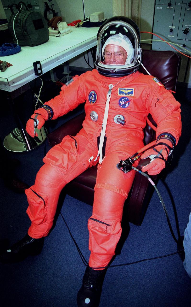 In the Operations and Checkout Building, STS-95 Payload Specialist John H. Glenn Jr., senator from Ohio, participates in a complete suit check. The STS-95 crew were conducting flight crew equipment fit checks prior to launch on Oct. 29. STS-95 is expected to launch at 2 p.m. EST on Oct. 29, last 8 days, 21 hours and 49 minutes, and land at 11:49 a.m. EST on Nov. 7