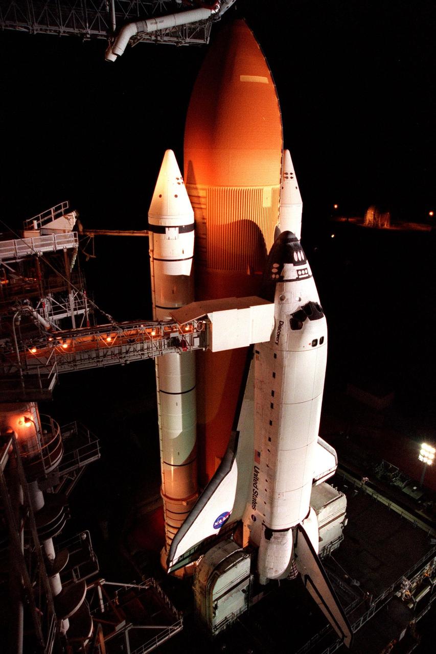 After its Rotational Service Structure is rolled back, the Space Shuttle Discovery awaits the dawn of day on its scheduled day of launch on mission STS-95 at Launch Pad 39B. Liftoff is scheduled for 2 p.m. on Oct. 29. The STS-95 mission is expected to last almost 9 days, with a landing at KSC at 11:49 a.m. EST on Nov. 7