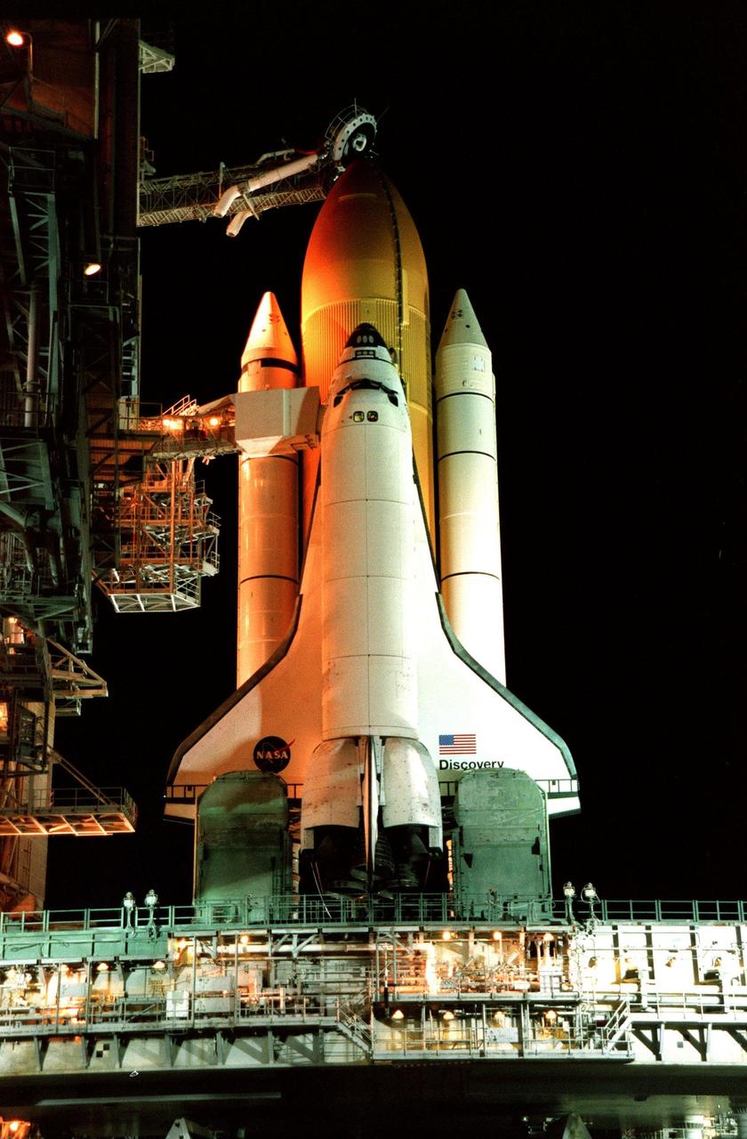 After its Rotational Service Structure is rolled back, the Space Shuttle Discovery awaits the dawn of day on its scheduled day of launch on mission STS-95 at Launch Pad 39B. Liftoff is scheduled for 2 p.m. on Oct. 29. The STS-95 mission is expected to last almost 9 days, with a landing at KSC at 11:49 a.m. EST on Nov. 7