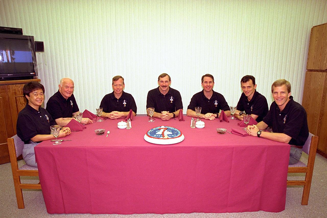 The STS-95 crew gathers at their traditional pre-launch breakfast in the Operations and Checkout Building. Seated from left are Payload Specialist Chiaki Mukai, (M.D., Ph.D.), with the National Space Development Agency of Japan (NASDA), Payload Specialist John H. Glenn Jr., senator from Ohio, Pilot Steven W. Lindsey, Mission Commander Curtis L. Brown Jr., Mission Specialist Stephen K. Robinson, Mission Specialist Pedro Duque of Spain, representing the European Space Agency (ESA), and Mission Specialist Scott E. Parazynski. Targeted for launch at 2 p.m. EST on Oct. 29, the mission is expected to last 8 days, 21 hours and 49 minutes, and return to KSC at 11:49 a.m. EST on Nov. 7. The STS-95 mission includes research payloads such as the Spartan solar-observing deployable spacecraft, the Hubble Space Telescope Orbital Systems Test Platform, the International Extreme Ultraviolet Hitchhiker, as well as the SPACEHAB single module with experiments on space flight and the aging process