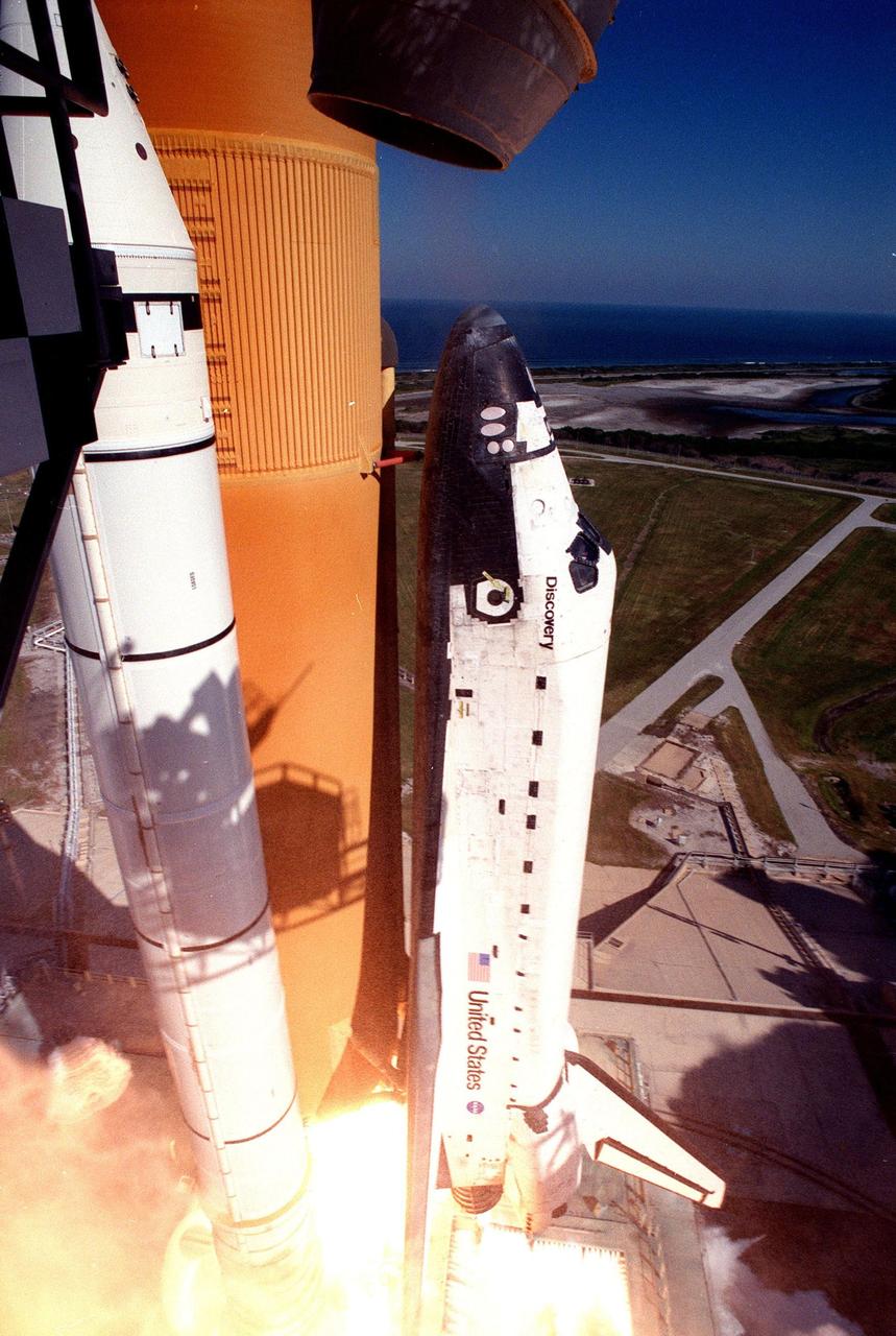 Thousands of gallons of water released as part of the sound suppression system at the launch pad create clouds of steam and exhaust as Space Shuttle Discovery lifts off from Launch Pad 39B at 2:19 p.m. EST Oct. 29 on mission STS-95. Making his second voyage into space after 36 years is Payload Specialist John H. Glenn Jr., senator from Ohio. Other crew members are Mission Commander Curtis L. Brown Jr., Pilot Steven W. Lindsey, Payload Specialist Chiaki Mukai, (M.D., Ph.D.), with the National Space Development Agency of Japan (NASDA), Mission Specialist Stephen K. Robinson, Mission Specialist Pedro Duque of Spain, representing the European Space Agency (ESA), and Mission Specialist Scott E. Parazynski. The STS-95 mission includes research payloads such as the Spartan solar-observing deployable spacecraft, the Hubble Space Telescope Orbital Systems Test Platform, the International Extreme Ultraviolet Hitchhiker, as well as the SPACEHAB single module with experiments on space flight and the aging process. Discovery is expected to return to KSC at 11:49 a.m. EST on Nov. 7
