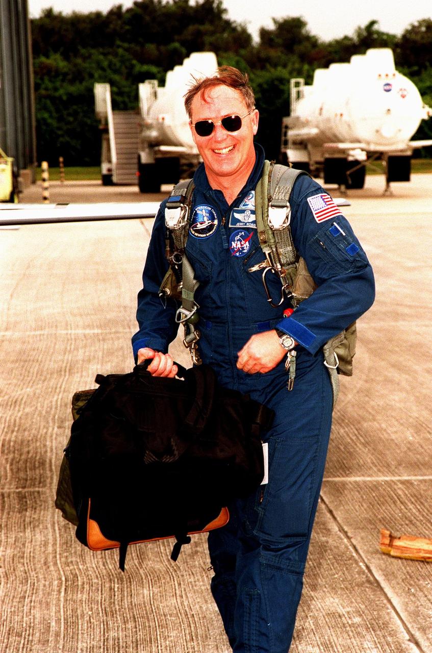 STS-88 Mission Specialist Jerry L. Ross arrives after dark at the Shuttle Landing Facility to take part in Terminal Countdown Demonstration Test (TCDT) activities. The TCDT provides the crew with simulated countdown exercises, emergency egress training, and opportunities to inspect their mission payloads in the orbiter's payload bay. Mission STS-88 is targeted for launch on Dec. 3, 1998. It is the first U.S. flight for the assembly of the International Space Station and will carry the Unity connecting module. Others in the STS-88 crew are Commander Robert D. Cabana, Pilot Frederick W. "Rick" Sturckow, Mission Specialists Nancy J. Currie and James H. Newman and Russian cosmonaut Sergei Konstantinovich Krikalev. Ross and Newman will make three spacewalks to connect power, data and utility lines and install exterior equipment