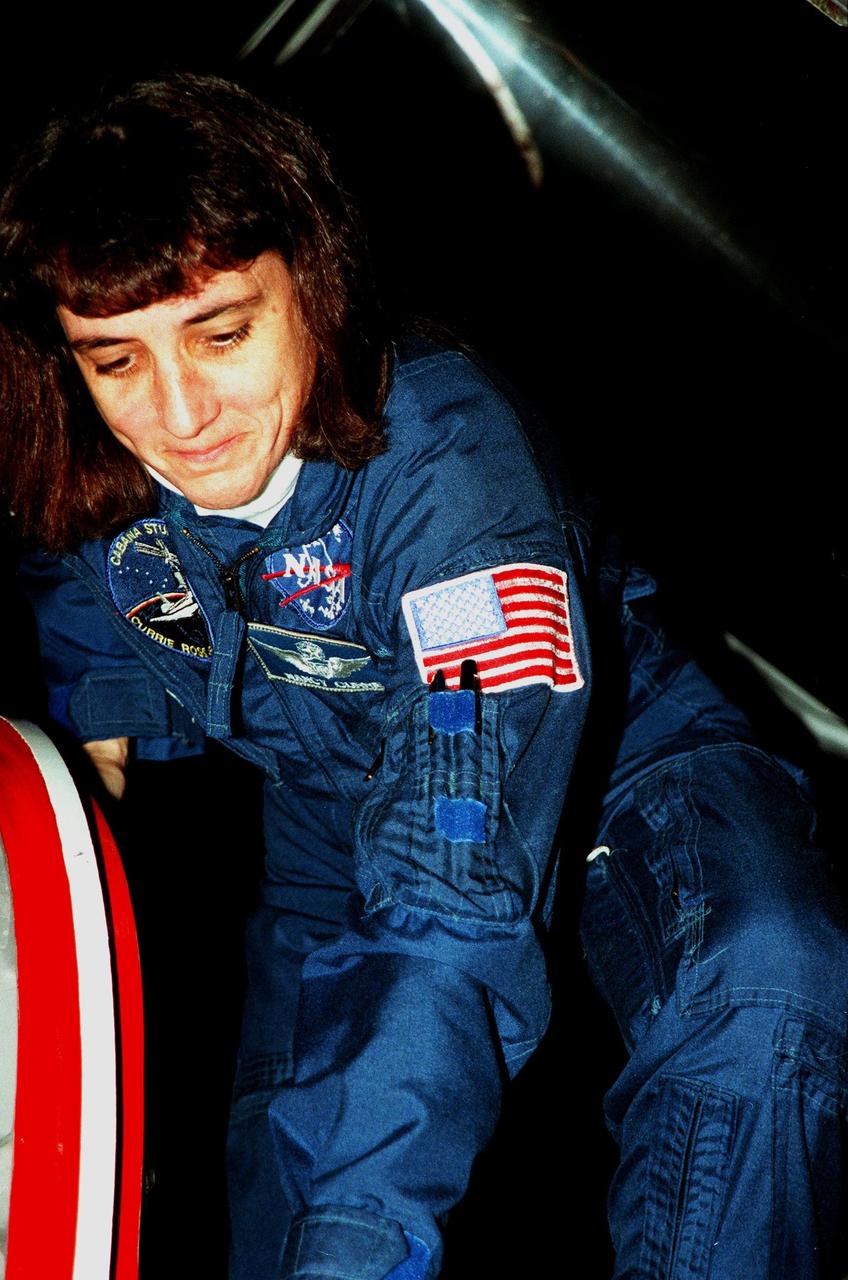 STS-88 Mission Specialist Nancy J. Currie climbs out of a T-38 jet aircraft in which she arrived after dark at the Shuttle Landing Facility in order to take part in Terminal Countdown Demonstration Test (TCDT) activities. The TCDT provides the crew with simulated countdown exercises, emergency egress training, and opportunities to inspect their mission payloads in the orbiter's payload bay. Mission STS-88 is targeted for launch on Dec. 3, 1998. It is the first U.S. flight for the assembly of the International Space Station and will carry the Unity connecting module. Others in the STS-88 crew are Mission Commander Robert D. Cabana, Pilot Frederick W. "Rick" Sturckow, Mission Specialists Jerry L. Ross, James H. Newman and Sergei Krikalev, a Russian cosmonaut. Ross and Newman will make three spacewalks to connect power, data and utility lines and install exterior equipment