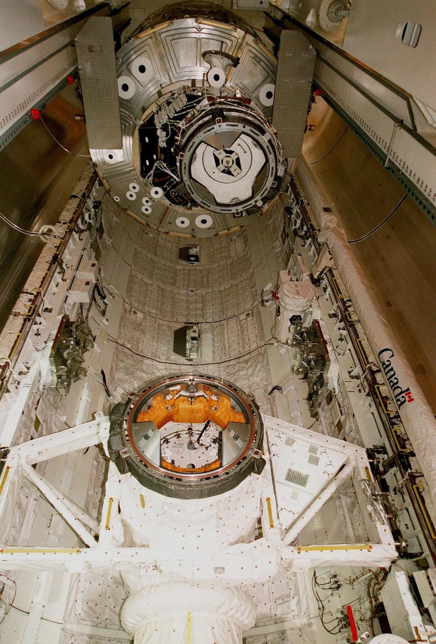 Viewed from below, the Unity connecting module is moved into the payload bay of the orbiter Endeavour at Launch Pad 39A. Part of the International Space Station (ISS), Unity is scheduled for launch Dec. 3, 1998, on Mission STS-88. The Unity is a connecting passageway to the living and working areas of ISS. While on orbit, the flight crew will deploy Unity from the payload bay and attach it to the Russian-built Zarya control module which will be in orbit at that time