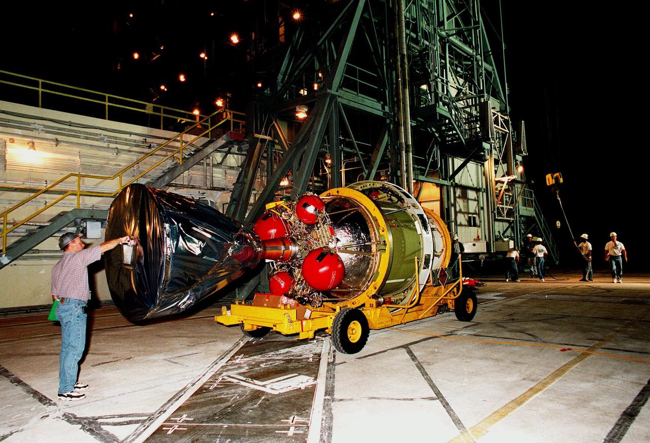 The second stage of a Delta II rocket arrives at pad 17A at Cape Canaveral Air Station. The rocket is scheduled to be launched on Dec. 10, 1998, heading for Mars and carrying the Mars Climate Orbiter. The orbiter's instruments will monitor the Martian atmosphere and image the planet's surface on a daily basis for 657 days. It will observe the appearance and movement of atmospheric dust and water vapor, as well as characterize seasonal changes on the surface. The detailed images of the surface features will provide important clues to the planet's early climate history and give scientists more information about possible liquid water reserves beneath the surface. The orbiter will primarily support its companion Mars Polar Lander spacecraft, which is planned for launch on Jan. 3, 1999