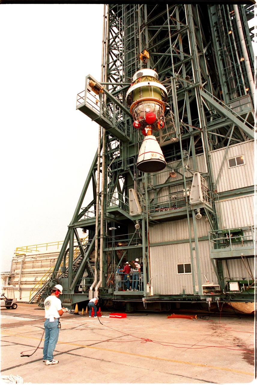 At pad 17A, Cape Canaveral Air Station, the second stage of a Delta II rocket is lifted up the gantry . The rocket is scheduled to be launched on Dec. 10, 1998, heading for Mars and carrying the Mars Climate Orbiter. The orbiter's instruments will monitor the Martian atmosphere and image the planet's surface on a daily basis for 657 days. It will observe the appearance and movement of atmospheric dust and water vapor, as well as characterize seasonal changes on the surface. The detailed images of the surface features will provide important clues to the planet's early climate history and give scientists more information about possible liquid water reserves beneath the surface. The orbiter will primarily support its companion Mars Polar Lander spacecraft, which is planned for launch on Jan. 3, 1999