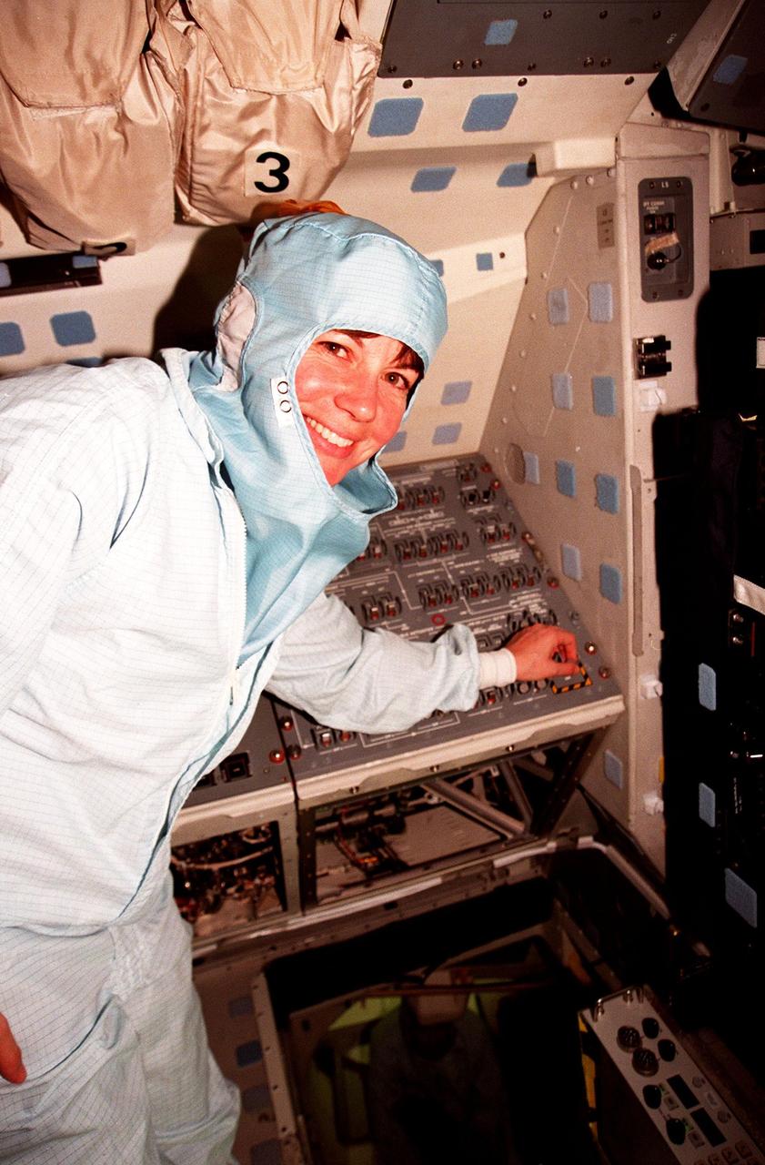 In the Orbiter Processing Facility Bay 3, during the Crew Equipment Interface Test (CEIT), Mission Specialist Catherine G. Coleman checks equipment that will fly on mission STS-93. The STS-93 mission will deploy the Advanced X-ray Astrophysics Facility (AXAF) which comprises three major elements: the spacecraft, the telescope, and the science instrument module (SIM). AXAF will allow scientists from around the world to obtain unprecedented X-ray images of a variety of high-energy objects to help understand the structure and evolution of the universe. The other STS-93 crew members are Mission Commander Eileen M. Collins, Pilot Jeffrey S. Ashby, Mission Specialist Steven A. Hawley and Mission Specialist Michel Tognini of France. Targeted date for the launch of STS-93 is March 18, 1999
