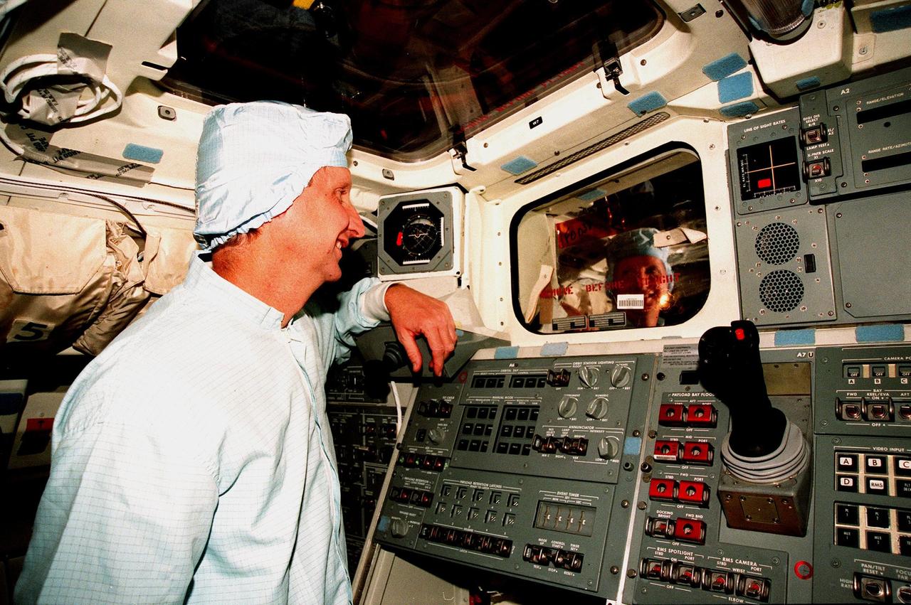 In the Orbiter Processing Facility Bay 3, during the Crew Equipment Interface Test (CEIT) for mission STS-93, Mission Specialist Steven A. Hawley checks out equipment in the orbiter Columbia. The CEIT provides an opportunity for crew members to check equipment and facilities that will be aboard the orbiter during their mission. The STS-93 mission will deploy the Advanced X-ray Astrophysics Facility (AXAF), which comprises three major elements: the spacecraft, the telescope, and the science instrument module (SIM). AXAF will allow scientists from around the world to obtain unprecedented X-ray images of a variety of high-energy objects to help understand the structure and evolution of the universe. The other STS-93 crew members are Mission Commander Eileen M. Collins, Pilot Jeffrey S. Ashby, Mission Specialist Catherine G. Coleman and Mission Specialist Michel Tognini of France. Targeted date for the launch of STS-93 is March 18, 1999