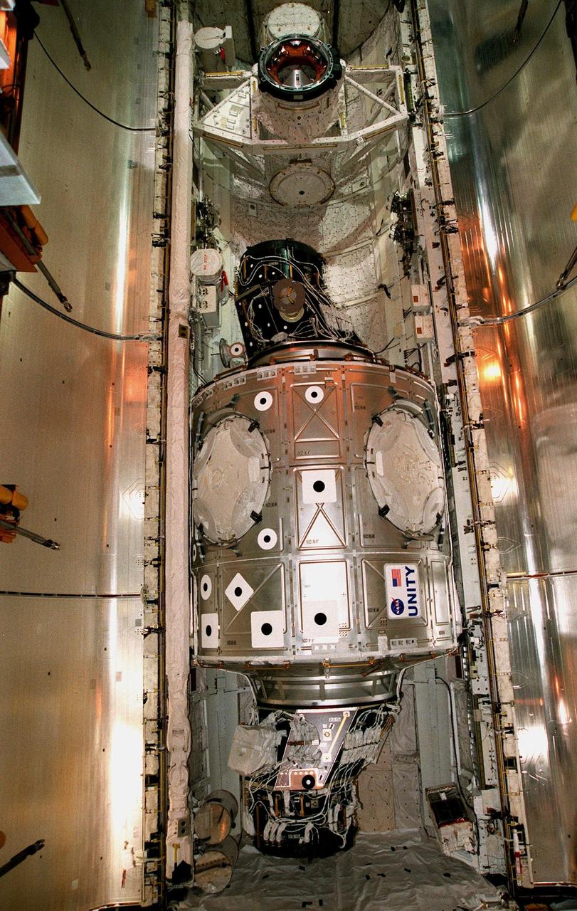 The Unity connecting module rests inside the open payload bay of the orbiter Endeavour at Launch Pad 39A. At the top of bay is the docking mechanism first used with launches to Mir, the Russian space station. Unity is the first U.S. element of the International Space Station (ISS) and is scheduled for launch Dec. 3, 1998, on Mission STS-88. The Unity is a connecting passageway to the living and working areas of ISS. While on orbit, the flight crew will deploy Unity from the payload bay and attach it to the Russian-built Zarya control module which will be in orbit at that time. The mission is expected to last nearly 12 days, landing back at the Kennedy Space Center on Dec. 14