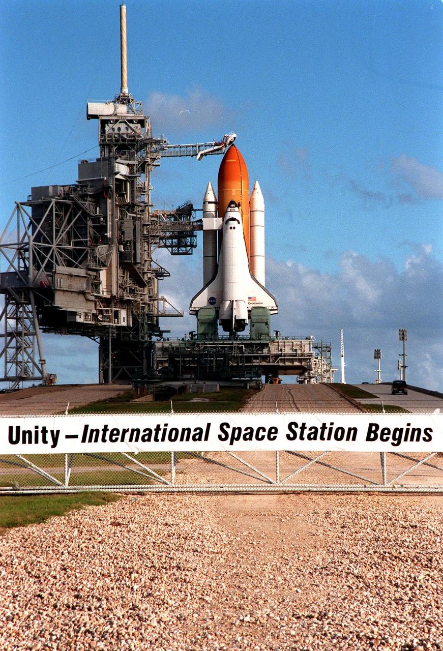 KENNEDY SPACE CENTER, FLA. -- The sign on the fence at Launch Pad 39A announces the mission of STS-88 and Space Shuttle Endeavour, poised on the pad for launch. Lift-off is targeted for 3:56 a.m. on Dec. 3. The first U.S. launch for the International Space Station, STS-88 is expected to last 11 days, 19 hours and 49 minutes, and land at 10:17 p.m. EST on Dec. 14. Endeavour carries the Unity connecting module which the crew will be mating with the Russian-built Zarya control module already in orbit. In addition to Unity, two small replacement electronics boxes are on board for possible repairs to Zarya batteries