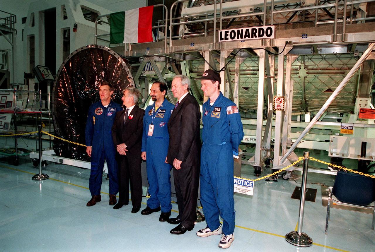 KENNEDY SPACE CENTER, FLA. -- Participants pose for a photo at the Space Station Processing Facility ceremony transferring the "Leonardo" Multipurpose Logistics Module (MPLM) from the Italian Space Agency, Agenzia Spaziale Italiana (ASI), to NASA. From left, they are astronaut Jim Voss, ASI President Sergio De Julio, European Space Agency astronaut Umberto Guidoni of Italy, NASA Administrator Daniel S. Goldin and European Space Agency astronaut Christer Fuglesang of Sweden. The MPLM, a reusable logistics carrier, will be the primary delivery system used to resupply and return International Space Station cargo requiring a pressurized environment. Leonardo is the first of three MPLM carriers for the International Space Station. It is scheduled to be launched on Space Shuttle Mission STS-100, targeted for April 2000