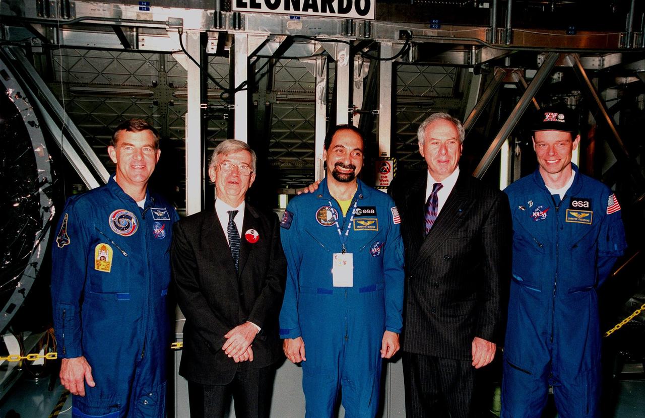 KENNEDY SPACE CENTER, FLA. -- Participants pose for a photo at the Space Station Processing Facility ceremony transferring the "Leonardo" Multipurpose Logistics Module (MPLM) from the Italian Space Agency, Agenzia Spaziale Italiana (ASI), to NASA. From left, they are astronaut Jim Voss, ASI President Sergio De Julio, European Space Agency astronaut Umberto Guidoni of Italy, NASA Administrator Daniel S. Goldin and European Space Agency astronaut Christer Fuglesang of Sweden. The MPLM, a reusable logistics carrier, will be the primary delivery system used to resupply and return International Space Station cargo requiring a pressurized environment. Leonardo is the first of three MPLM carriers for the International Space Station. It is scheduled to be launched on Space Shuttle Mission STS-100, targeted for April 2000