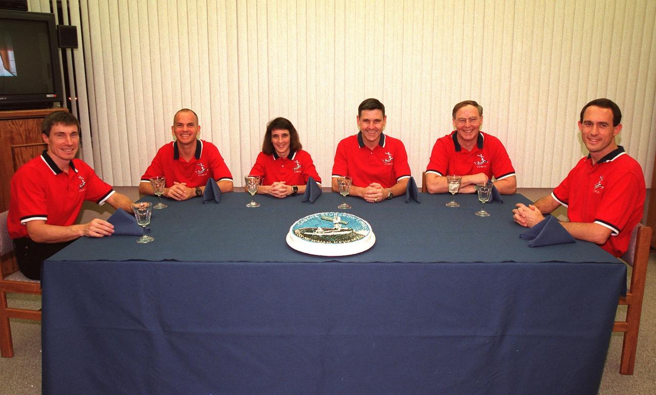 As part of the final STS-88 prelaunch activities, the six crew members gather for a last meal before liftoff and a photo opportunity in the Operations and Checkout Building. From left, they are Mission Specialist Sergei Konstantinovich Krikalev, a Russian cosmonaut; Pilot Frederick W. "Rick" Sturckow; Mission Specialist Nancy J. Currie; Commander Robert D. Cabana; and Mission Specialists Jerry L. Ross and James H. Newman. STS-88 will be the first U.S. launch dedicated to the assembly of the International Space Center. Liftoff aboard the Space Shuttle Endeavour is targeted for 3:36 a.m. EST, Dec. 4, from Launch Pad 39A