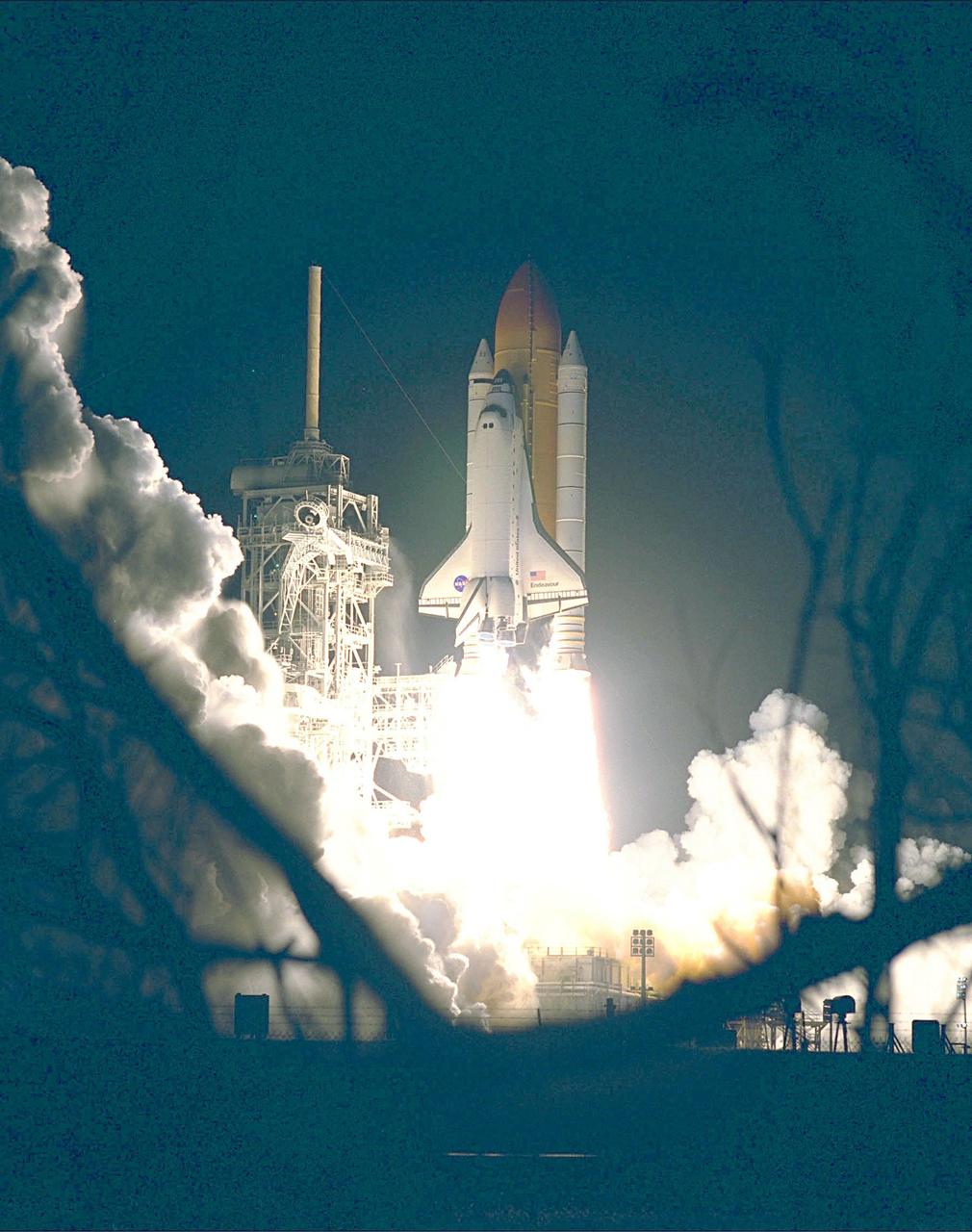 KENNEDY SPACE CENTER, Fla. --   The Space Shuttle Endeavour lights up the night sky as it embarks on the first U.S. mission dedicated to the assembly of the International Space Station. Liftoff on Dec. 4 from Launch Pad 39A was at 3:35:34 a.m. EST. During the nearly 12-day mission, the six-member crew will mate in space the first two elements of the International Space Station the already-orbiting Zarya control module with the Unity connecting module carried by Endeavour. Crew members are Commander Robert D. Cabana, Pilot Frederick W. "Rick" Sturckow, and Mission Specialists Nancy J. Currie, Jerry L. Ross, James H. Newman and Sergei Konstantinovich Krikalev, a Russian cosmonaut. This was the second launch attempt for STS-88. The first one on Dec. 3 was scrubbed when launch controllers, following an assessment of a suspect hydraulic system, were unable to resume the countdown clock in time to launch within the remaining launch window