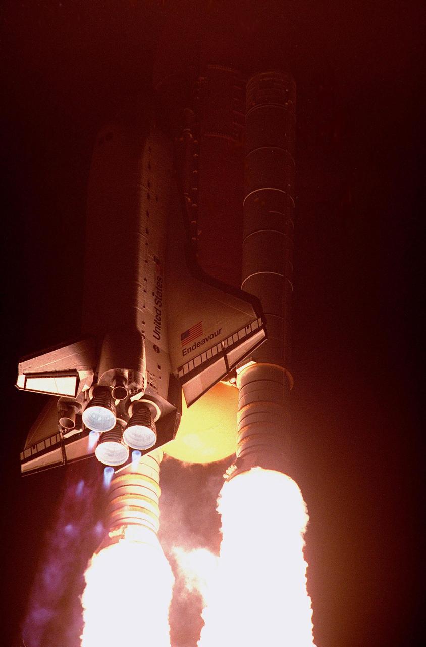 KENNEDY SPACE CENTER, Fla. --  The Space Shuttle Endeavour blazes through the night sky as it begins the first U.S. mission, STS-88, dedicated to the assembly of the International Space Station. Liftoff on Dec. 4 from Launch Pad 39A was at 3:35:34 a.m. EST. During the nearly 12-day mission, the six-member crew will mate in space the first two elements of the International Space Station the already-orbiting Zarya control module with the Unity connecting module carried by Endeavour. Crew members are Commander Robert D. Cabana, Pilot Frederick W. "Rick" Sturckow, and Mission Specialists Nancy J. Currie, Jerry L. Ross, James H. Newman and Sergei Konstantinovich Krikalev, a Russian cosmonaut. This was the second launch attempt for STS-88. The first one on Dec. 3 was scrubbed when launch controllers, following an assessment of a suspect hydraulic system, were unable to resume the countdown clock in time to launch within the remaining launch window