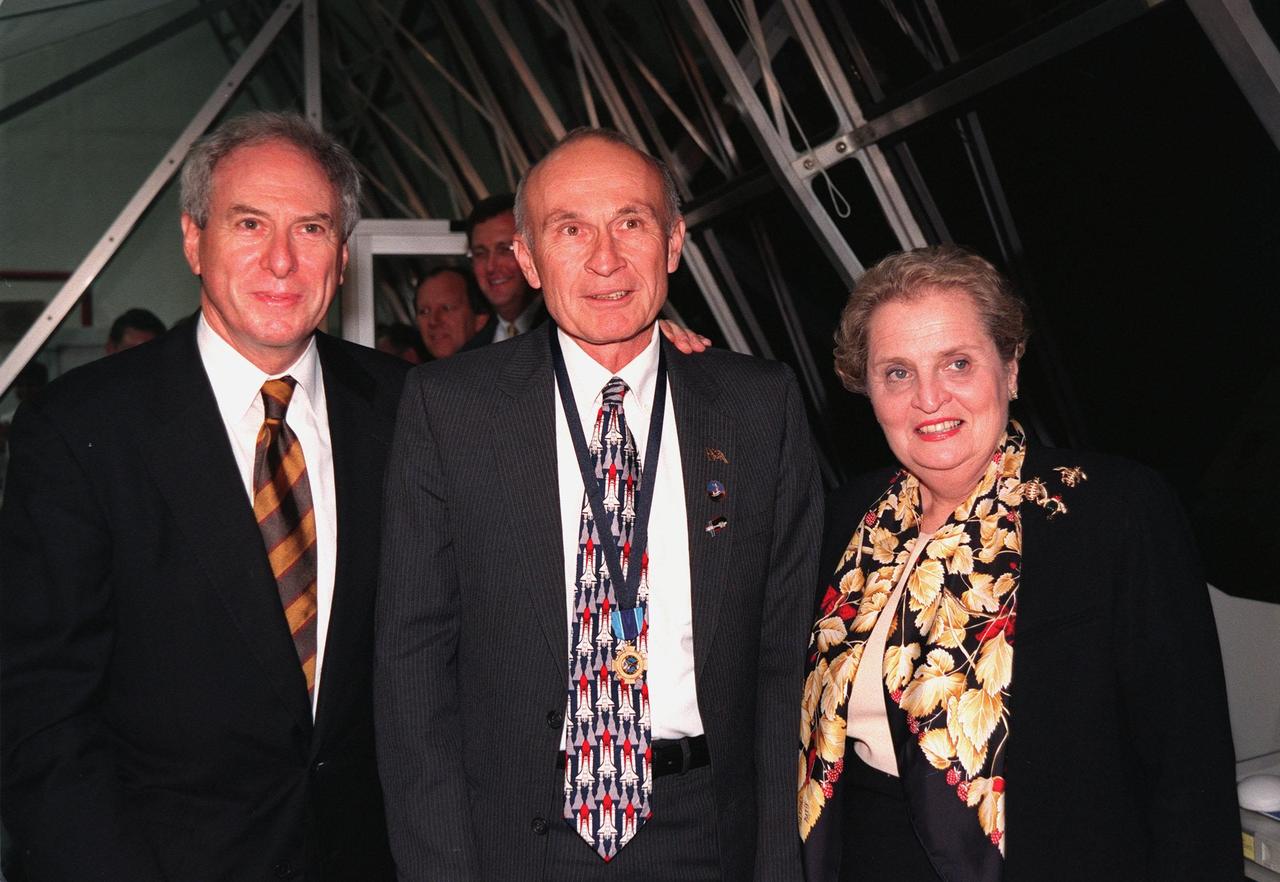 NASA Administrator Daniel Goldin (left), KSC Director of Shuttle Operations Robert B. Sieck (center) and Secretary of State Madeleine Albright (right) pose in the firing room of the Launch Control Center following the successful launch of Space Shuttle Endeavour on mission STS-88 at 3:35:34 a.m. EST. Sieck is wearing around his neck the Distinguished Service Medal presented him by Goldin just after launch. The medal, the highest honor NASA confers on a government employee, recognizes someone who has personally made a contribution representing substantial and extraordinary progress to the mission of NASA