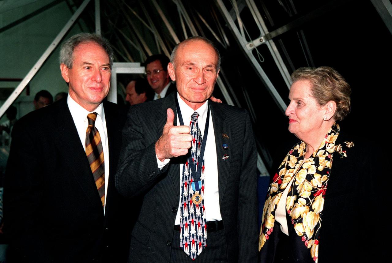 In a firing room of the Launch Control Center, KSC Director of Shuttle Operations Robert B. Sieck (center) gives a thumbs up after the successful launch of Space Shuttle Endeavour on mission STs-88 at 3:35:34 a.m. EST. With him are NASA Administrator Daniel Goldin (left) and U.S. Secretary of State Madeleine Albright (right). Sieck is wearing around his neck the Distinguished Service Medal presented to him by Goldin following the launch. The medal, the highest honor NASA confers on a government employee, recognizes someone who has personally made a contribution representing substantial and extraordinary progress to the mission of NASA