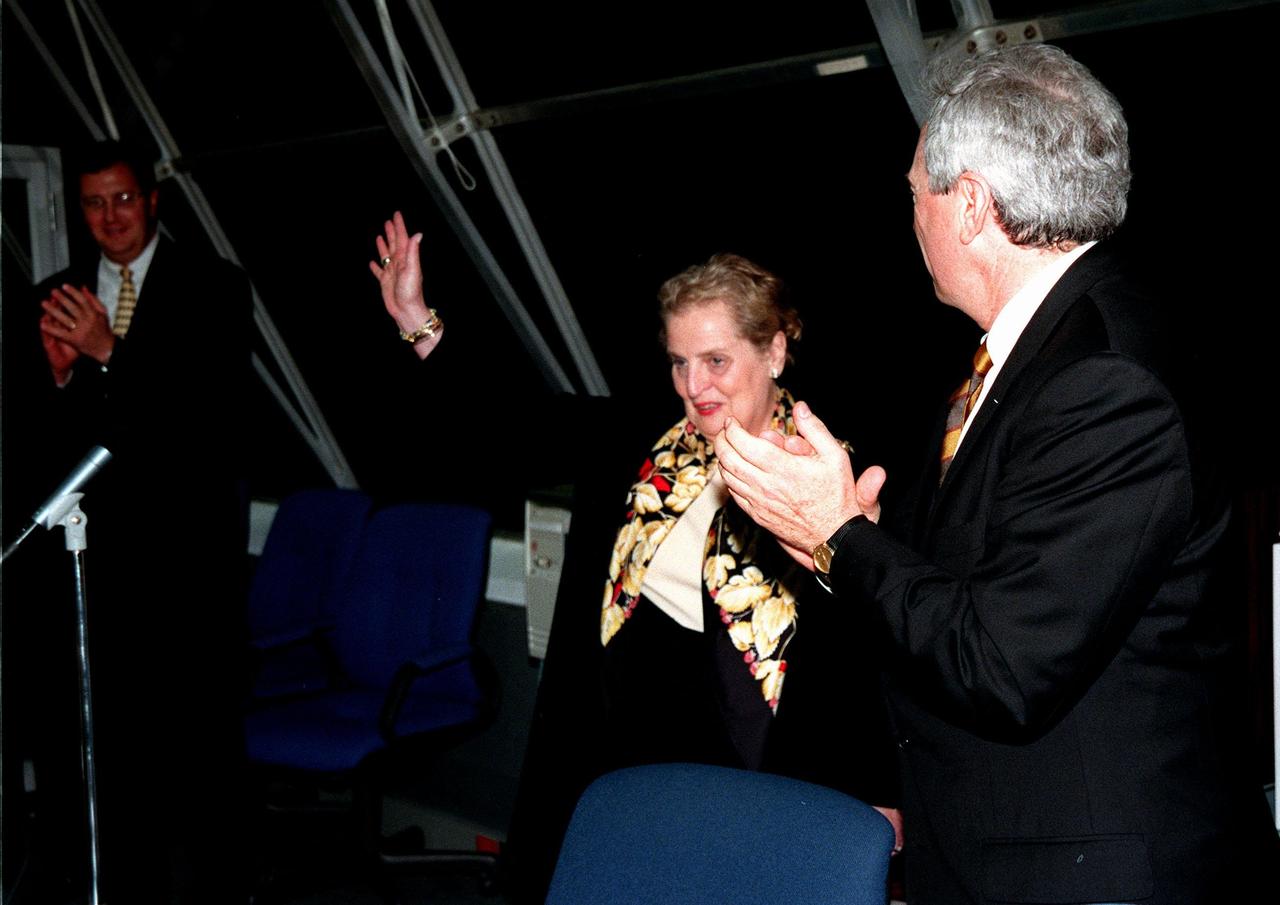 In a firing room of the Launch Control Center,U.S. Secretary of State Madeleine Albright waves to the personnel after her speech about the successful launch of Space Shuttle Endeavour. At her right is NASA Administrator Daniel Goldin. During the nearly 12-day mission of STS-88, the six-member crew will mate in space the first two elements of the International Space Station the already-orbiting Zarya control module and the Unity connecting module carried by Endeavour