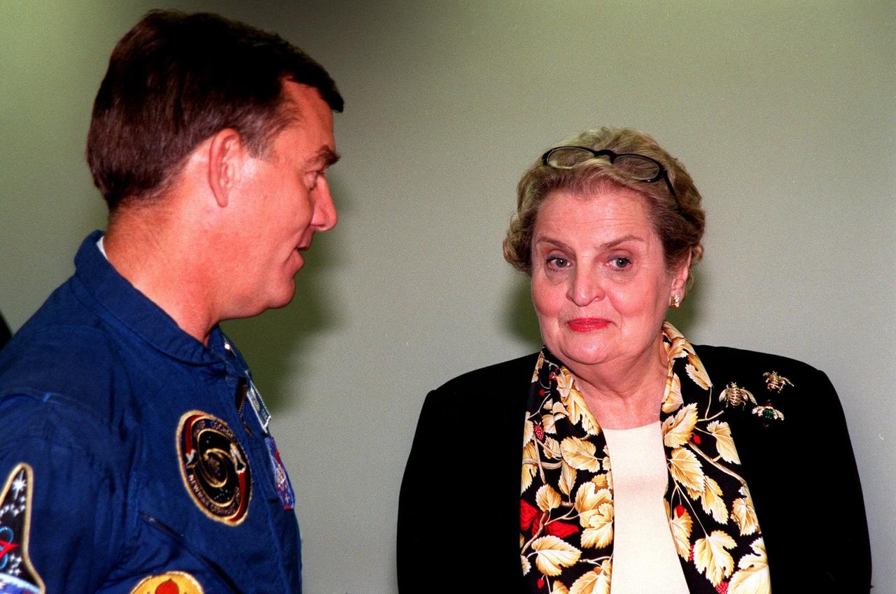U.S. Secretary of State Madeleine Albright (right) talks with astronaut Jim Voss following the successful launch of Endeavour on Mission STS-88 from Launch Pad 39A at 3:35:34 a.m. EST. STS-88 is the first U.S. mission dedicated to the assembly of the International Space Station (ISS). Voss is a member of the STS-100 crew, the eighth ISS assembly team