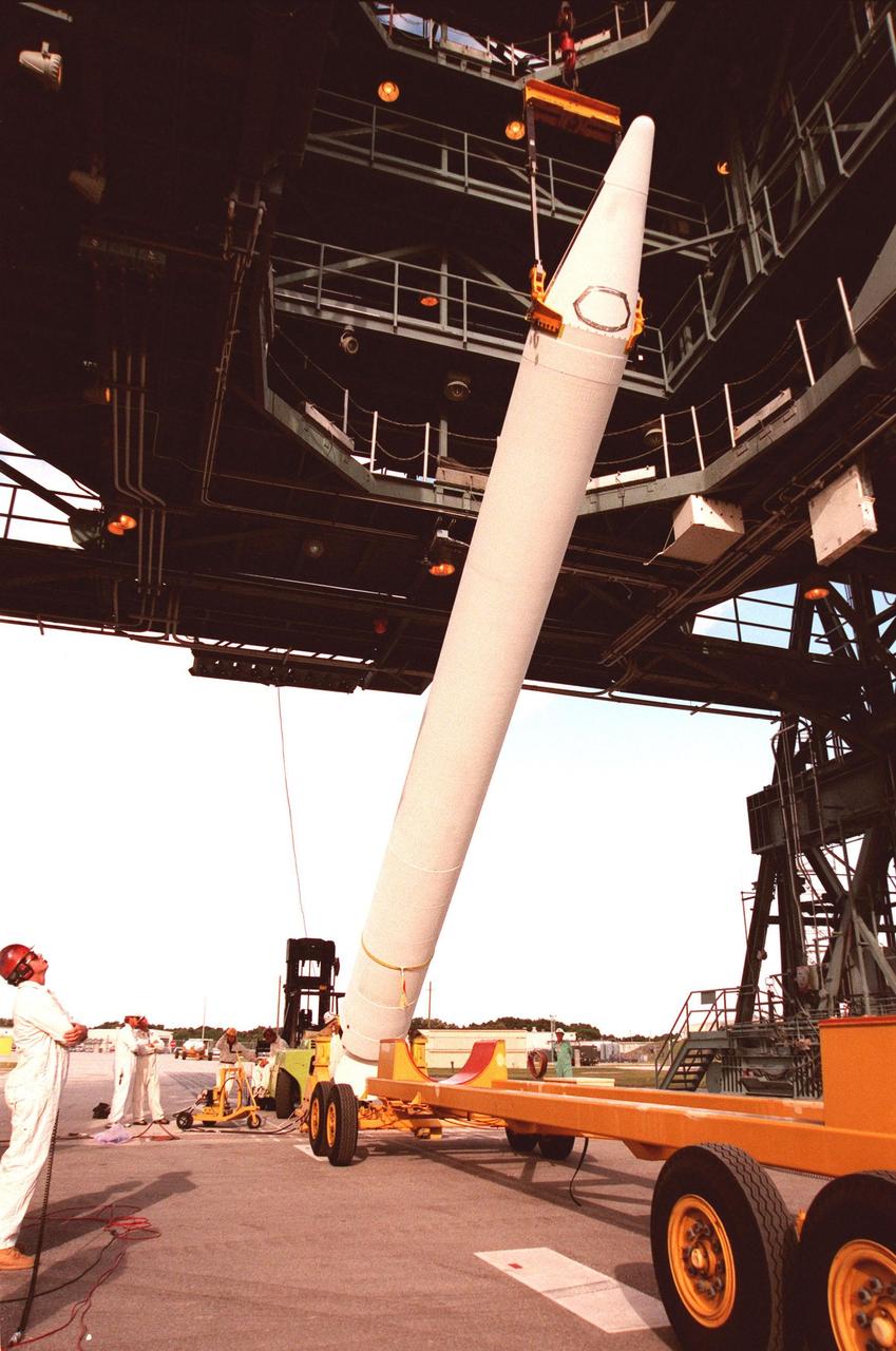 KENNEDY SPACE CENTER, FLA. -- On Pad 17B, Cape Canaveral Air Station, a solid rocket booster is raised to a vertical position for mating with the Delta II rocket carrying the Mars Polar Lander. The rocket will be used to launch the Mars Polar Lander on Jan. 3, 1999. The lander is a solar-powered spacecraft designed to touch down on the Martian surface near the northern-most boundary of the south pole in order to study the water cycle there. The lander also will help scientists learn more about climate change and current resources on Mars, studying such things as frost, dust, water vapor and condensates in the Martian atmosphere. It is the second spacecraft to be launched in a pair of Mars '98 missions. The first is the Mars Climate Orbiter, to be launched aboard a Delta II rocket from Launch Complex 17A in December 1998