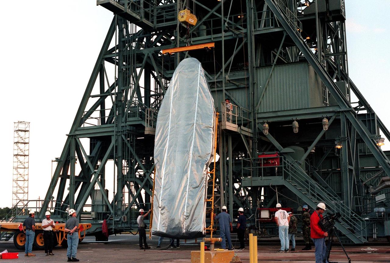 KENNEDY SPACE CENTER, FLA. -- The fairing for the upper stages of the Delta II rocket carrying the Mars Polar Lander is lifted to a vertical position on Pad 17B, Cape Canaveral Air Station. The rocket will be used to launch the Mars Polar Lander on Jan. 3, 1999. The lander is a solar-powered spacecraft designed to touch down on the Martian surface near the northern-most boundary of the south pole in order to study the water cycle there. The lander also will help scientists learn more about climate change and current resources on Mars, studying such things as frost, dust, water vapor and condensates in the Martian atmosphere. It is the second spacecraft to be launched in a pair of Mars '98 missions. The first is the Mars Climate Orbiter, to be launched aboard a Delta II rocket from Launch Complex 17A in December 1998
