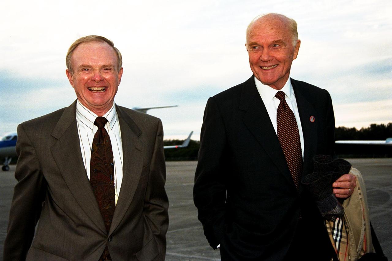 Ohio Senator John Glenn, at right, walks with Kennedy Space Center (KSC) Director Roy Bridges shortly after Glenn's arrival at KSC's Shuttle Landing Facility on Jan. 20 to tour KSC operational areas and to view the launch of STS-89 later this week. Glenn, who made history in 1962 as the first American to orbit the Earth, completing three orbits in a five-hour flight aboard Friendship 7, will fly his second space mission aboard Space Shuttle Discovery this October. Glenn is retiring from the Senate at the end of this year and will be a payload specialist aboard STS-95