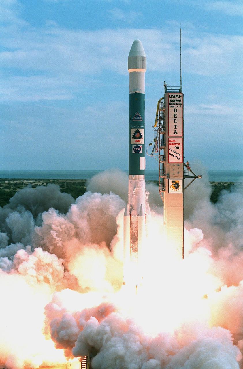 KENNEDY SPACE CENTER, FLA. -- A Boeing Delta II expendable launch vehicle lifts off with NASA's Mars Climate Orbiter at 1:45:51 p.m. EST, on Dec. 11, 1998, from Launch Complex 17A, Cape Canaveral Air Station. The launch was delayed one day when personnel detected a battery-related software problem in the spacecraft. The problem was corrected and the launch was rescheduled for the next day. The first of a pair of spacecraft to be launched in the Mars Surveyor '98 Project, the orbiter is heading for Mars where it will first provide support to its companion Mars Polar Lander spacecraft, which is planned for launch on Jan. 3, 1999. The orbiter's instruments will then monitor the Martian atmosphere and image the planet's surface on a daily basis for one Martian year (1.8 Earth years). It will observe the appearance and movement of atmospheric dust and water vapor, as well as characterize seasonal changes on the surface. The detailed images of the surface features will provide important clues to the planet's early climate history and give scientists more information about possible liquid water reserves beneath the surface