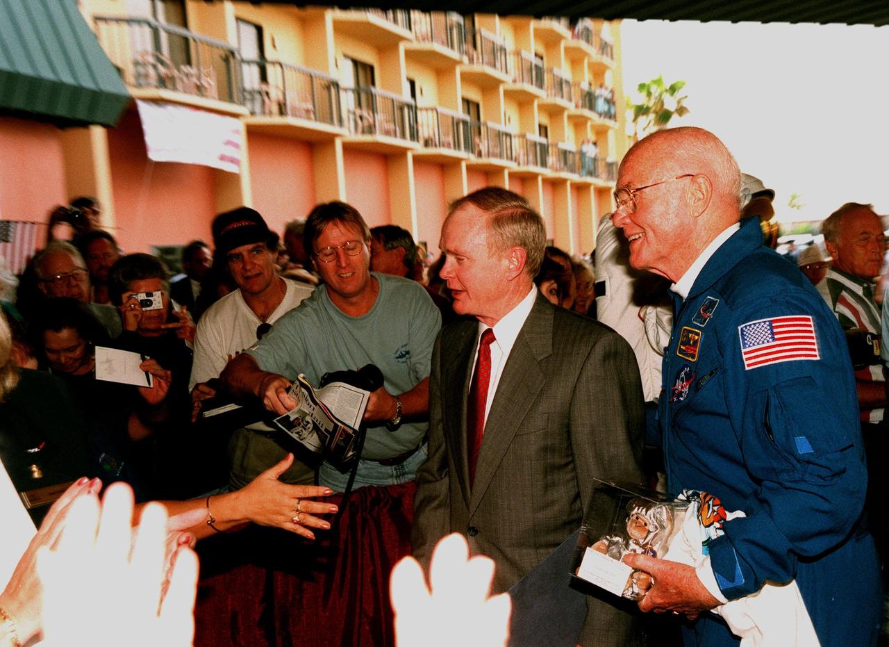 Center Director Roy Bridges and STS-95 Payload Specialist John H. Glenn Jr. greet well-wishers at a reception at the Double Tree Oceanfront Hotel following a parade down State Road A1A in nearby Cocoa Beach. Organizers of the parade included the Cocoa Beach Area Chamber of Commerce, the Brevard County Tourist Development Council, and the cities of Cape Canaveral and Cocoa Beach. The parade is reminiscent of those held after missions during the Mercury Program