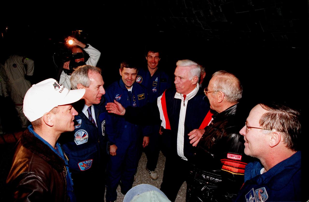 Following their touchdown on Runway 15 at 10:53:29 p.m. EST, STS-88 crew members are greeted by NASA Administrator Daniel Goldin and former astronauts Eugene A. Cernan and James A. Lovell Jr. From left are Pilot Frederick W. "Rick" Sturckow, Goldin , Commander Robert D. Cabana, Mission Specialist Sergei Konstantinovich Krikalev, Cernan, Lovell and Mission Specialist Jerry L. Ross. Cernan flew on Gemini 9, Apollo 10 and 17 and has more than 566 cumulative hours of space flight. Lovell flew on Gemini 7 and 12, Apollo 8 and 13. His cumulative hours of space flight are more than 715. On the 4.6-million-mile, nearly 12-day STS-88 mission, Endeavour carried the U.S.-built Unity connecting module to begin construction of the International Space Station. The crew successfully mated Unity with the Russian-built Zarya control module during three space walks. With this mission, Ross completed seven space walks totaling 44 hours and 9 minutes, more than any other American space walker. Newman moved into third place for U.S. space walks with a total of 28 hours and 27 minutes on four excursions