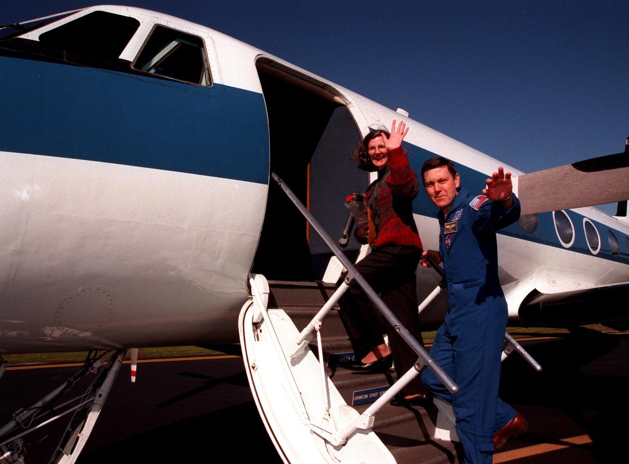 STS-88 Commander Robert D. Cabana and his wife, Nancy, enter the airplane that will return them to Houston and the Johnson Space Center. They will be joined by other crew members, with their families, Pilot Frederick W. "Rick" Sturckow. Mission Specialists Sergei Konstantinovich Krikalev, James H. Newman, Jerry L. Ross and Nancy J. Currie. The STS-88 crew returned Dec. 15 from a 12-day mission on orbit constructing the first elements of the International Space Station, the U.S.-built Unity connecting module and Russian-built Zarya control module