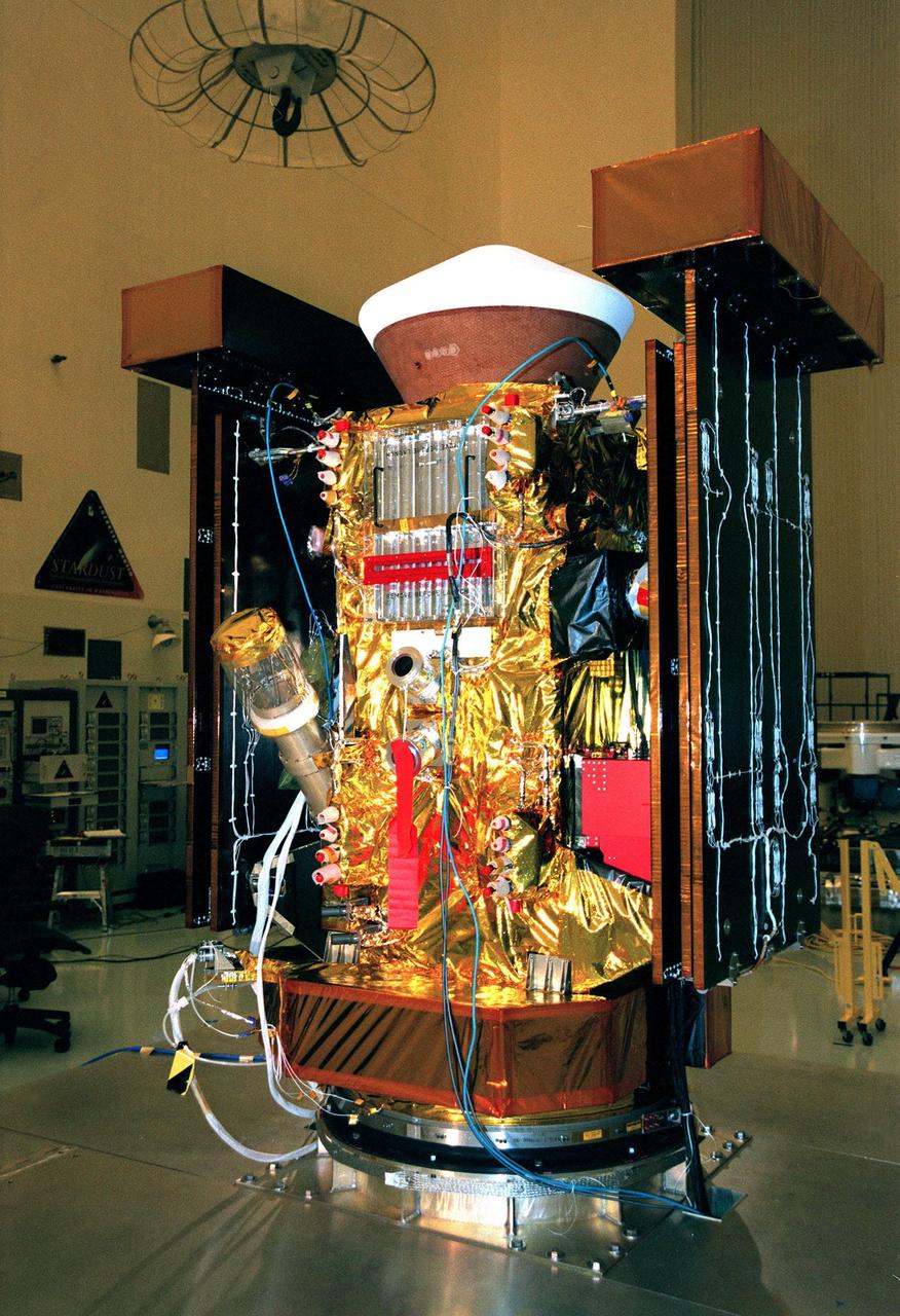 In the Payload Hazardous Servicing Facility, closeout of the <a href="http://www-pao.ksc.nasa.gov/kscpao/captions/subjects/stardust.htm">Stardust</a> spacecraft is complete. Stardust will use a unique medium called aerogel to capture comet particles flying off the nucleus of comet Wild 2 in January 2004, plus collect interstellar dust for later analysis. The collected samples will return to Earth in the SRC to be jettisoned as it swings by Earth in January 2006. Stardust is scheduled to be launched aboard a Boeing Delta 7426 rocket from Complex 17, Cape Canaveral Air Station, on Feb. 6, 1999