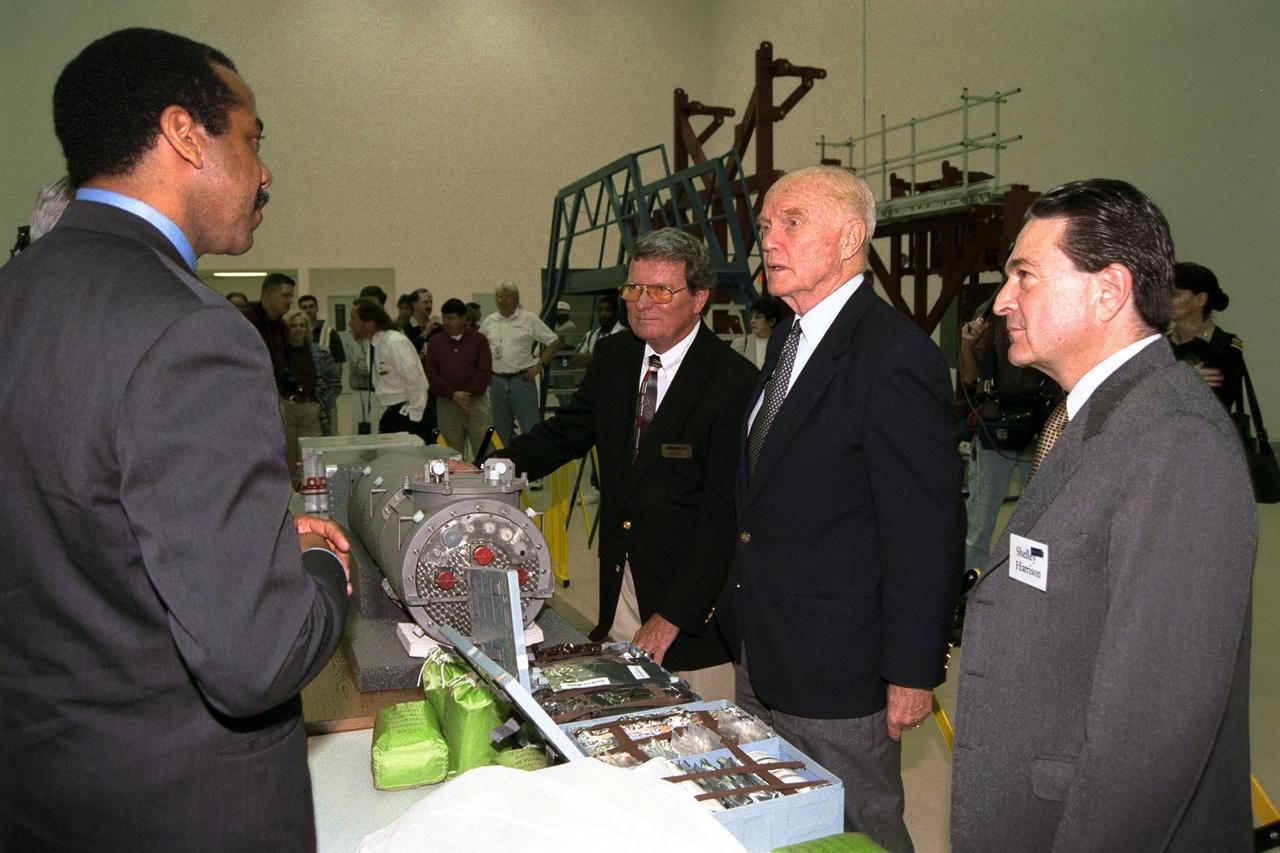 Ohio Senator John Glenn, second from right, enjoys a tour of the SPACEHAB Payload Processing Facility in Cape Canaveral. Joining Senator Glenn are, left to right, Dr. Bernard Harris, SPACEHAB vice president, microgravity and life sciences; Dale Steffey, SPACEHAB vice president, operations; and Dr. Shelley Harrison, SPACEHAB chairman and chief executive officer. Senator Glenn arrived at KSC on Jan. 20 to tour KSC operational areas and to view the launch of STS-89 later this week. Glenn, who made history in 1962 as the first American to orbit the Earth, completing three orbits in a five-hour flight aboard Friendship 7, will fly his second space mission aboard Space Shuttle Discovery this October. Glenn is retiring from the Senate at the end of this year and will be a payload specialist aboard STS-95
