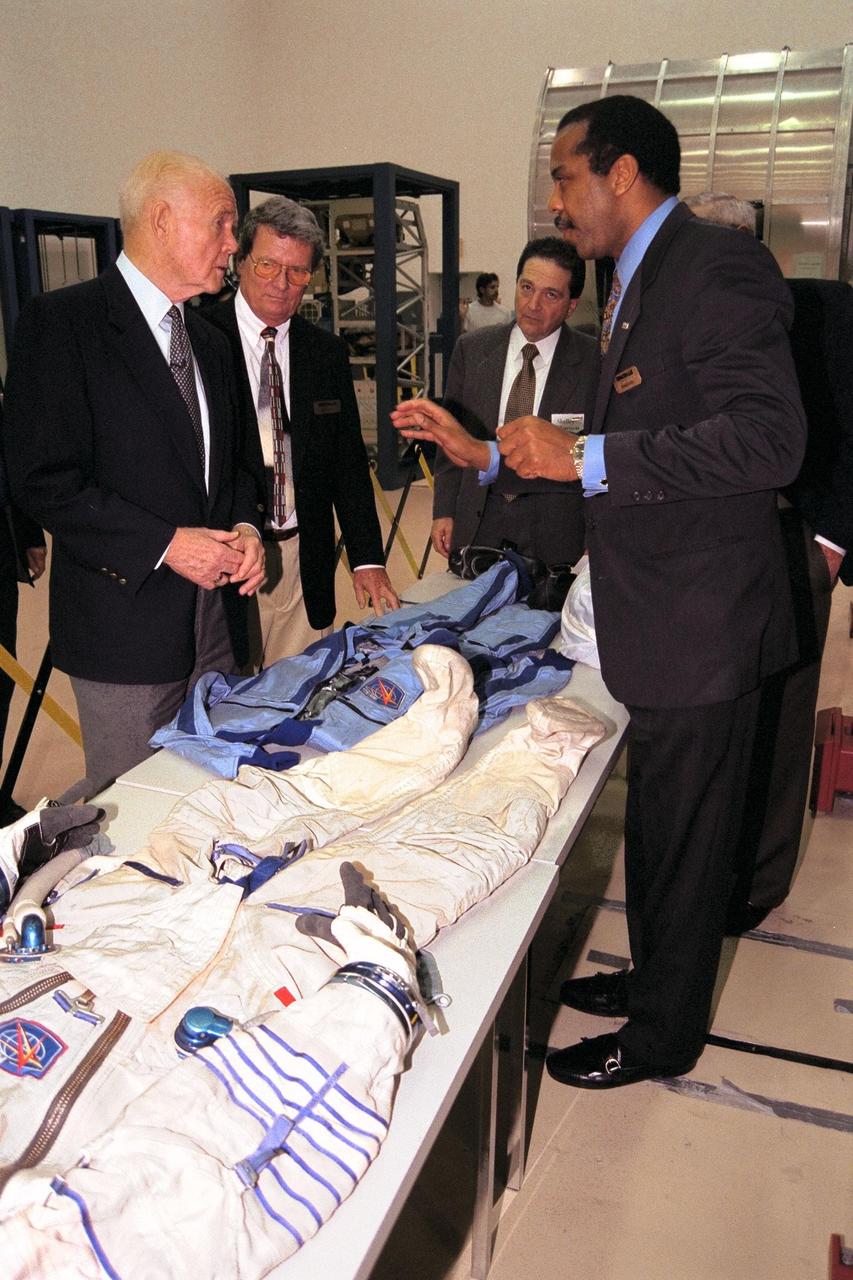 Ohio Senator John Glenn, at left, enjoys a tour of the SPACEHAB Payload Processing Facility in Cape Canaveral. Joining Senator Glenn are, left to right, Dale Steffey, SPACEHAB vice president, operations; Dr. Shelley Harrison, SPACEHAB chairman and chief executive officer; and Dr. Bernard Harris, SPACEHAB vice president, microgravity and life sciences. Senator Glenn arrived at KSC on Jan. 20 to tour KSC operational areas and to view the launch of STS-89 later this week. Glenn, who made history in 1962 as the first American to orbit the Earth, completing three orbits in a five-hour flight aboard Friendship 7, will fly his second space mission aboard Space Shuttle Discovery this October. Glenn is retiring from the Senate at the end of this year and will be a payload specialist aboard STS-95