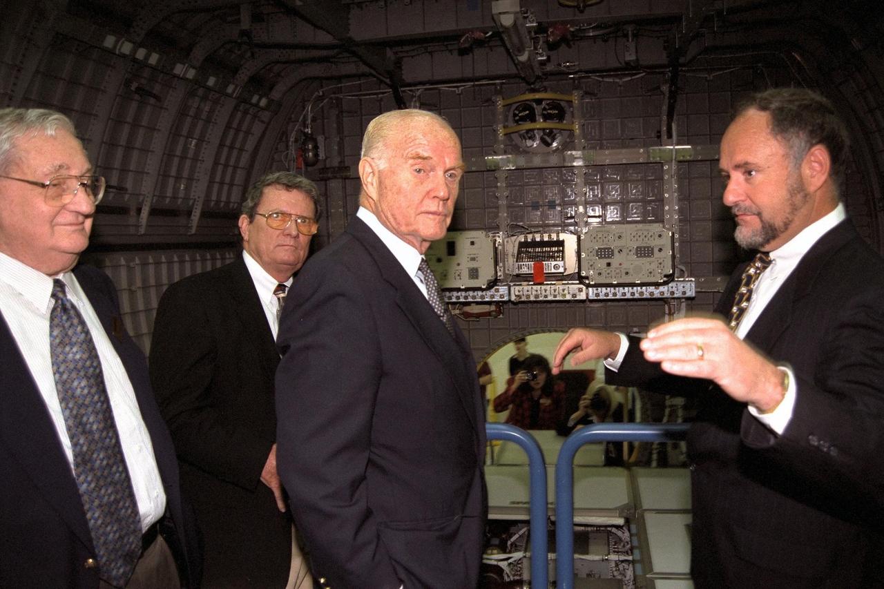 Ohio Senator John Glenn, center, enjoys a tour of the SPACEHAB Payload Processing Facility in Cape Canaveral. On his immediate left is Dale Steffey, SPACEHAB vice president, operations, and at the right of the photograph is Michael Lounge, SPACEHAB vice president, flight systems development. Senator Glenn arrived at KSC on Jan. 20 to tour KSC operational areas and to view the launch of STS-89 later this week. Glenn, who made history in 1962 as the first American to orbit the Earth, completing three orbits in a five-hour flight aboard Friendship 7, will fly his second space mission aboard Space Shuttle Discovery this October. Glenn is retiring from the Senate at the end of this year and will be a payload specialist aboard STS-95