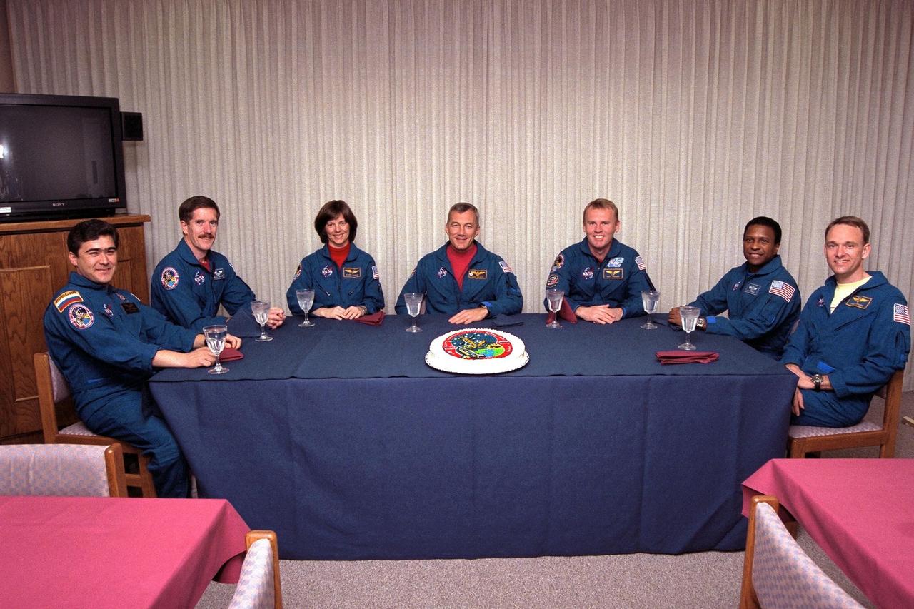The STS-89 crew enjoy the traditional pre-liftoff "breakfast" in the crew quarters of the Operations and Checkout Building. They are (from left) Mission Specialists Salizhan Sharipov of the Russian Space Agency, James Reilly, Ph.D., Bonnie Dunbar, Ph.D., Commander Terrence Wilcutt, Mission Specialists Andrew Thomas, Ph.D., Michael Anderson, and Pilot Joe Edwards Jr. After a weather briefing, the flight crew will be fitted with their launch/entry suits and depart for Launch Pad 39A. Once there, they will take their positions in the crew cabin of the Space Shuttle Endeavour to await a liftoff during a 10-minute window that will open at 9:43 p.m. EST, Jan. 22