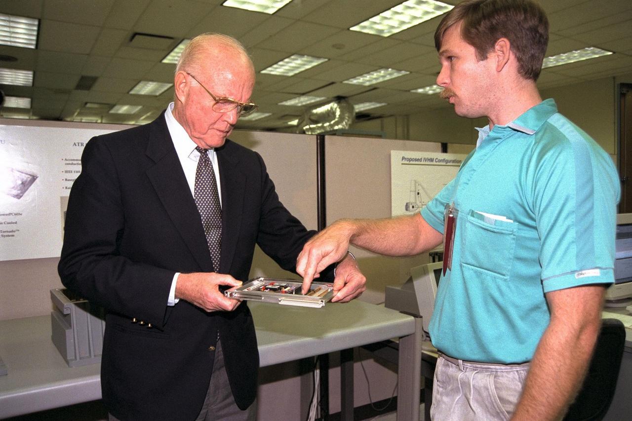 Ohio Senator John Glenn, at left, enjoys a tour of the Engineering Development Laboratory at Kennedy Space Center. Standing with Senator Glenn is Design Engineer David Kruhm of NASA Advanced Development and Shuttle Upgrades. Senator Glenn arrived at KSC on Jan. 20 to tour KSC operational areas and to view the launch of STS-89. Glenn, who made history in 1962 as the first American to orbit the Earth, completing three orbits in a five-hour flight aboard Friendship 7, will fly his second space mission aboard Space Shuttle Discovery this October. Glenn is retiring from the Senate at the end of this year and will be a payload specialist aboard STS-95