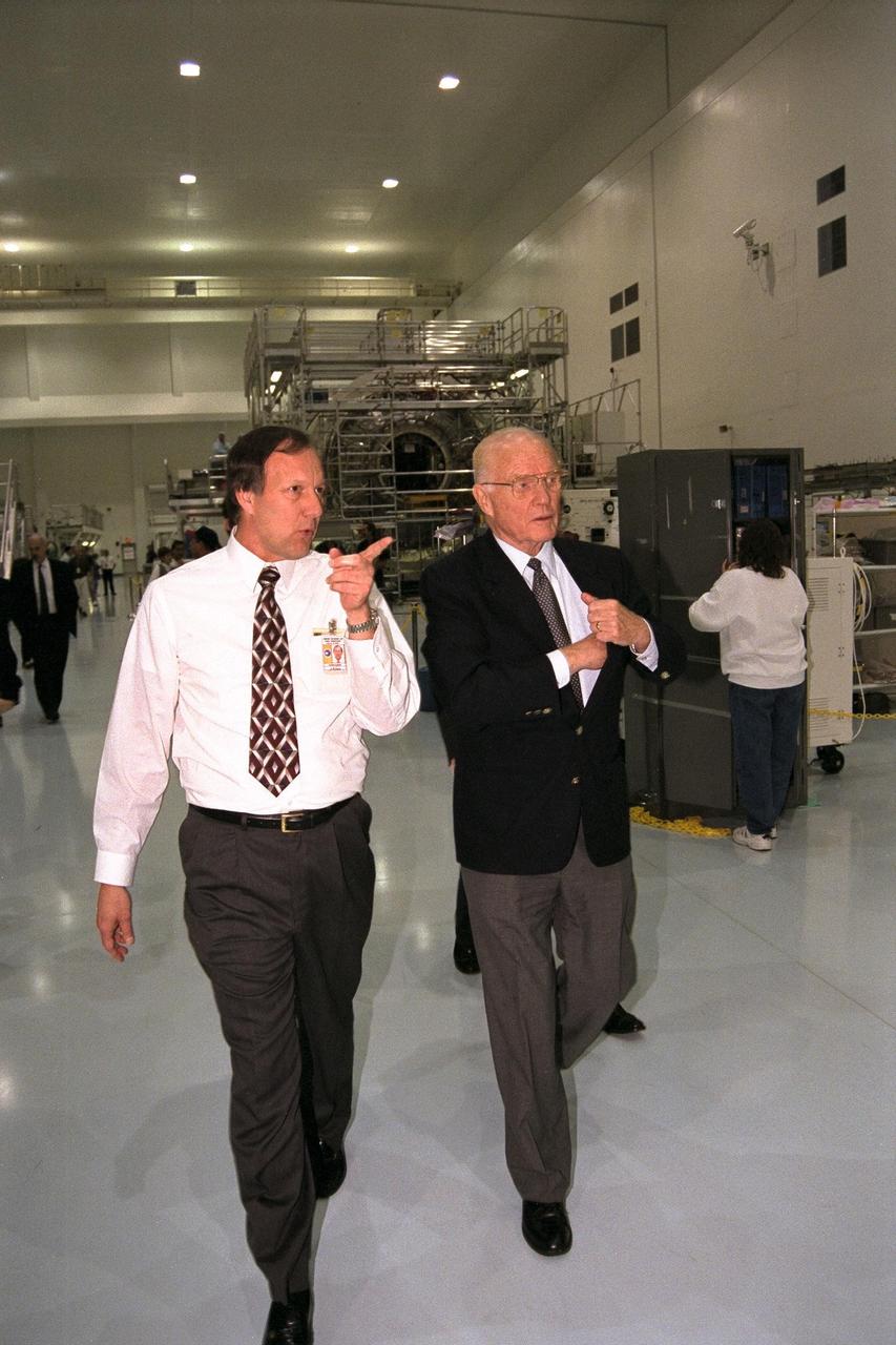 Ohio Senator John Glenn, at right, enjoys a tour of the Space Station Processing Facility at Kennedy Space Center. With Senator Glenn is Stephen Francois, director, Space Station and Shuttle Payloads, NASA. Senator Glenn arrived at KSC on Jan. 20 to tour KSC operational areas and to view the launch of STS-89. Glenn, who made history in 1962 as the first American to orbit the Earth, completing three orbits in a five-hour flight aboard Friendship 7, will fly his second space mission aboard Space Shuttle Discovery this October. Glenn is retiring from the Senate at the end of this year and will be a payload specialist aboard STS-95