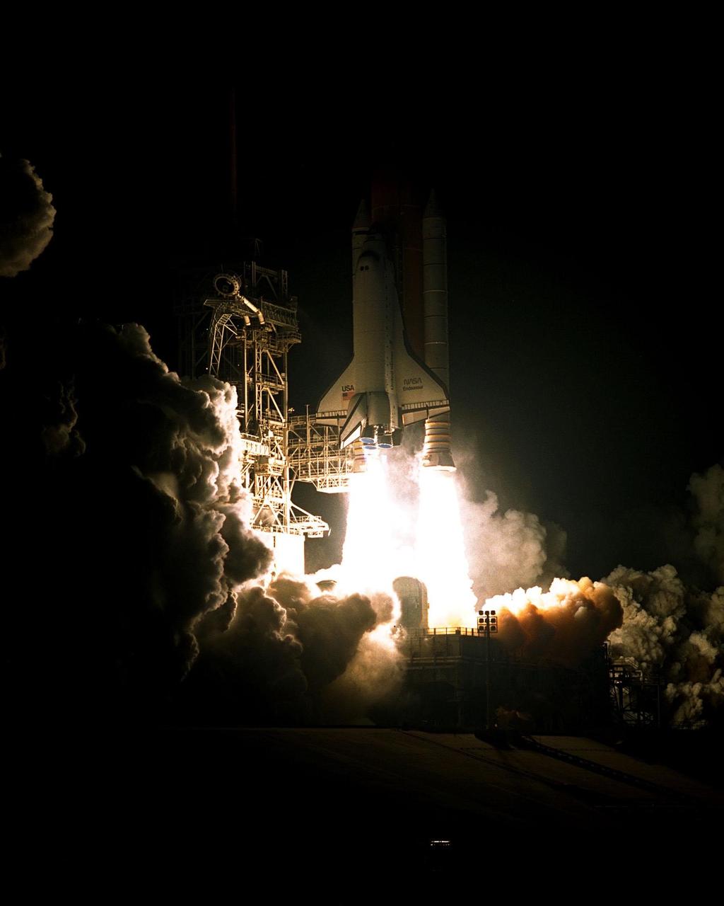 The Space Shuttle Endeavour cuts a bright swath through the dark sky as it blazes a trail toward the Russian Space Station Mir. Endeavour lifted off successfully at its scheduled time of 9:48:15 p.m. EST on Jan. 22 from Pad 39A. STS-89 is the eighth docking with the Russian Space Station Mir, the first Mir docking for Endeavour (all previous dockings were made by Atlantis), and the first launch of 1998. After docking with Mir, Mission Specialist Andrew Thomas, Ph.D., will transfer to the space station, succeeding David Wolf, M.D., who will return to Earth aboard Endeavour. Dr. Thomas will live and work on Mir until June