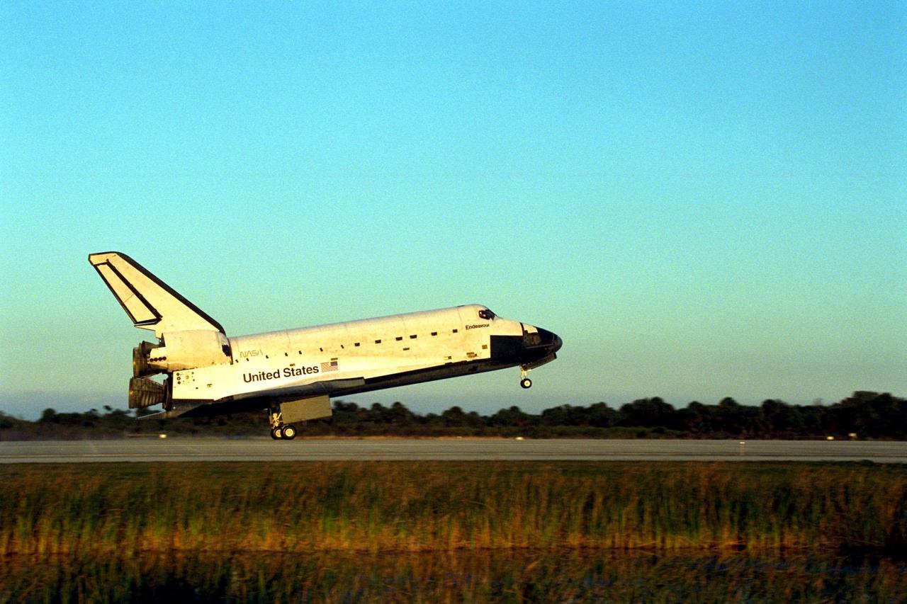 KENNEDY SPACE CENTER, Fla. -- The Space Shuttle orbiter Endeavour touches down on Runway 15 of the KSC Shuttle Landing Facility (SLF) to complete the nearly nine-day STS-89 mission. Main gear touchdown was at 5:35:09 p.m. EST on Jan. 31, 1998. The wheels stopped at 5:36:19 EST, completing a total mission time of eight days, 19 hours, 48 minutes and four seconds. The 89th Space Shuttle mission was the 42nd (and 13th consecutive) landing of the orbiter at KSC, and STS-89 was the eighth of nine planned dockings of the Space Shuttle with the Russian Space Station Mir. STS-89 Mission Specialist Andrew Thomas, Ph.D., succeeded NASA astronaut and Mir 24 crew member David Wolf, M.D., who was on the Russian space station since late September 1997. Dr. Wolf returned to Earth on Endeavour with the remainder of the STS-89 crew, including Commander Terrence Wilcutt; Pilot Joe Edwards Jr.; and Mission Specialists James Reilly, Ph.D.; Michael Anderson; Bonnie Dunbar, Ph.D.; and Salizhan Sharipov with the Russian Space Agency. Dr. Thomas is scheduled to remain on Mir until the STS-91 Shuttle mission returns in June 1998. In addition to the docking and crew exchange, STS-89 included the transfer of science, logistical equipment and supplies between the two orbiting spacecrafts