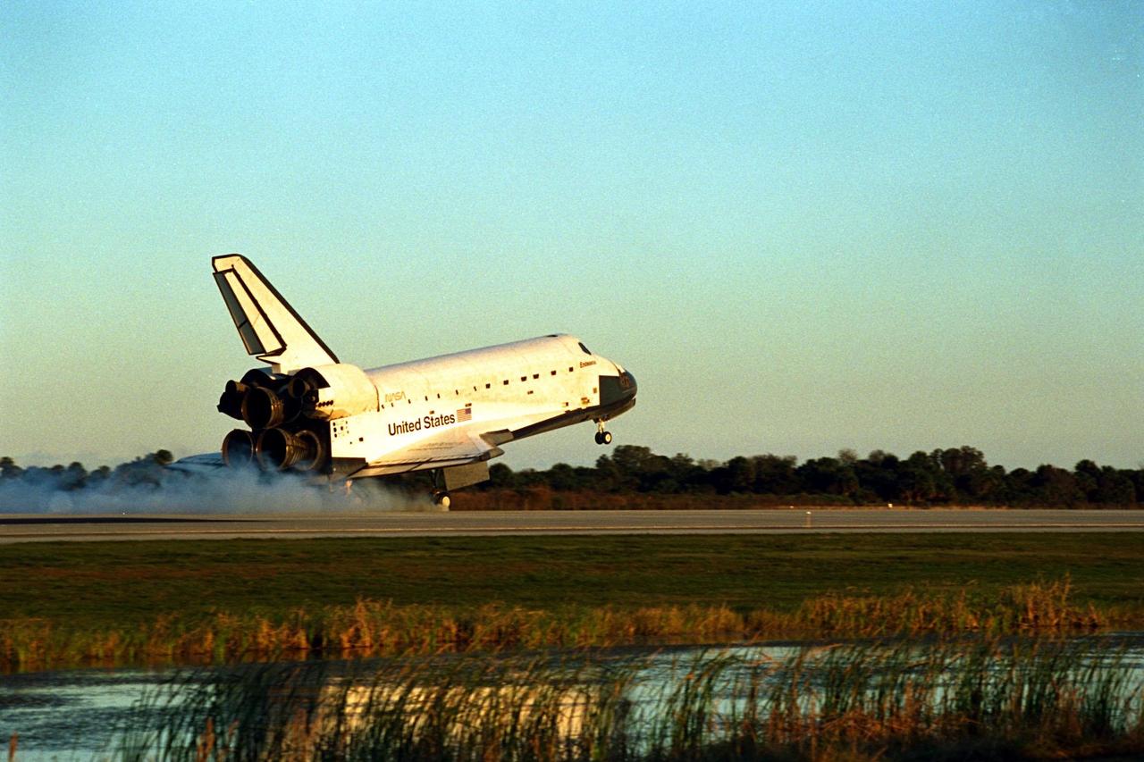 KENNEDY SPACE CENTER, Fla. -- The Space Shuttle orbiter Endeavour touches down on Runway 15 of the KSC Shuttle Landing Facility (SLF) to complete the nearly nine-day STS-89 mission. Main gear touchdown was at 5:35:09 p.m. EST on Jan. 31, 1998. The wheels stopped at 5:36:19 EST, completing a total mission time of eight days, 19 hours, 48 minutes and four seconds. The 89th Space Shuttle mission was the 42nd (and 13th consecutive) landing of the orbiter at KSC, and STS-89 was the eighth of nine planned dockings of the Space Shuttle with the Russian Space Station Mir. STS-89 Mission Specialist Andrew Thomas, Ph.D., succeeded NASA astronaut and Mir 24 crew member David Wolf, M.D., who was on the Russian space station since late September 1997. Dr. Wolf returned to Earth on Endeavour with the remainder of the STS-89 crew, including Commander Terrence Wilcutt; Pilot Joe Edwards Jr.; and Mission Specialists James Reilly, Ph.D.; Michael Anderson; Bonnie Dunbar, Ph.D.; and Salizhan Sharipov with the Russian Space Agency. Dr. Thomas is scheduled to remain on Mir until the STS-91 Shuttle mission returns in June 1998. In addition to the docking and crew exchange, STS-89 included the transfer of science, logistical equipment and supplies between the two orbiting spacecrafts