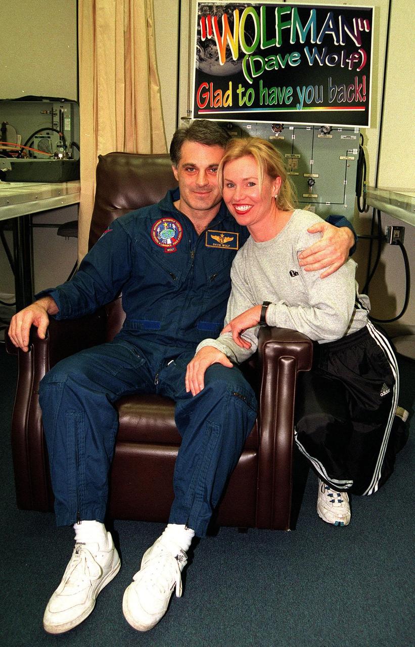 NASA astronaut and Mir 24 crew member David Wolf, M.D., who was on the Russian Space Station Mir since late September 1997, greets his friend, Tammy Kruse, shortly after his return to Earth on Jan. 31. Dr. Wolf returned aboard the orbiter Endeavour with the rest of the STS-89 crew, including Commander Terrence Wilcutt; Pilot Joe Edwards Jr.; and Mission Specialists James Reilly, Ph.D.; Michael Anderson; Bonnie Dunbar, Ph.D.; and Salizhan Sharipov with the Russian Space Agency. STS-89 Mission Specialist Andrew Thomas, Ph.D., succeeded Dr. Wolf on Mir and is scheduled to remain on the Russian space station until the STS-91 Shuttle mission returns in June 1998. In addition to the docking and crew exchange, STS-89 included the transfer of science, logistical equipment and supplies between the two orbiting spacecrafts