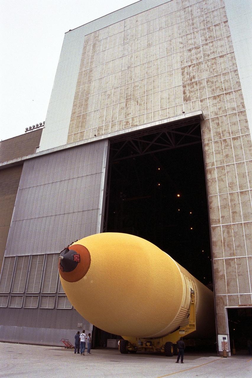 KENNEDY SPACE CENTER, FLA. -- The Space Shuttle's first super lightweight external tank is on its way into Kennedy Space Center's Vehicle Assembly Building for processing. The tank, which is scheduled for flight on STS-91 in late May, arrived Feb. 3 in Port Canaveral, where it remained until Feb. 6 due to high winds. The improved tank is 7,500 pounds lighter than its predecessors and was developed to increase the Shuttle payload capacity on International Space Station assembly flights. Major changes to the lighter tank include the use of new materials and a revised internal design. The new liquid oxygen and liquid hydrogen tanks are constructed of aluminum lithium a lighter, stronger material than the metal alloy currently used. The redesigned walls of the liquid hydrogen tank were machined to provide additional strength and stability as well