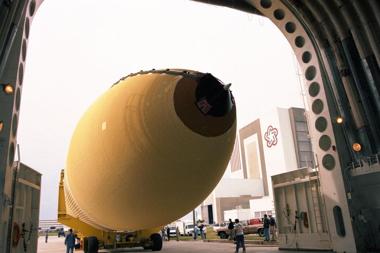 KENNEDY SPACE CENTER, FLA. -- The Space Shuttle's first super lightweight external tank is on its way to Kennedy Space Center's Vehicle Assembly Building for processing. The tank, which is scheduled for flight on STS-91 in late May, arrived Feb. 3 in Port Canaveral, where it remained until Feb. 6 due to high winds. It was moved by barge to KSC on Feb. 6. The improved tank is 7,500 pounds lighter than its predecessors and was developed to increase the Shuttle payload capacity on International Space Station assembly flights. Major changes to the lighter tank include the use of new materials and a revised internal design. The new liquid oxygen and liquid hydrogen tanks are constructed of aluminum lithium a lighter, stronger material than the metal alloy currently used. The redesigned walls of the liquid hydrogen tank were machined to provide additional strength and stability as well