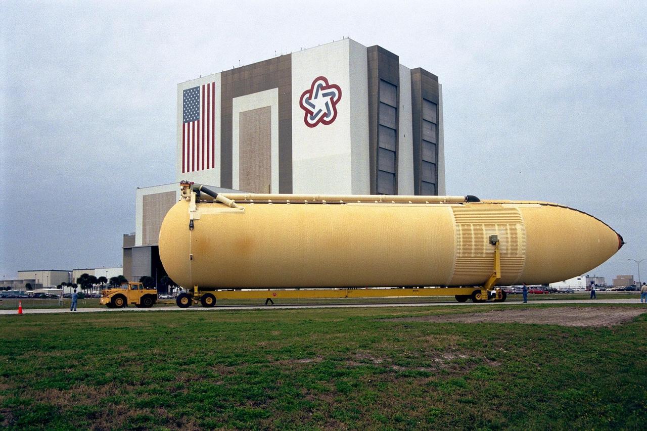 KENNEDY SPACE CENTER, FLA. -- The Space Shuttle's first super lightweight external tank is on its way to Kennedy Space Center's Vehicle Assembly Building for processing. The tank, which is scheduled for flight on STS-91 in late May, arrived Feb. 3 in Port Canaveral, where it remained until Feb. 6 due to high winds. The improved tank is 7,500 pounds lighter than its predecessors and was developed to increase the Shuttle payload capacity on International Space Station assembly flights. Major changes to the lighter tank include the use of new materials and a revised internal design. The new liquid oxygen and liquid hydrogen tanks are constructed of aluminum lithium a lighter, stronger material than the metal alloy currently used. The redesigned walls of the liquid hydrogen tank were machined to provide additional strength and stability as well