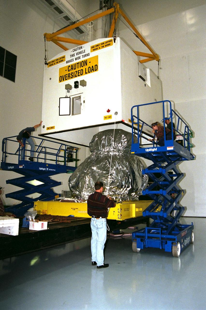 KENNEDY SPACE CENTER, FLA. -- The Pressurized Mating Adapter-3 (PMA-3), an element of the STS-92 mission scheduled for launch aboard Space Shuttle Atlantis in January 1999, arrived from the Boeing Company in Huntington Beach, Calif., for processing in KSC's Space Station Processing Facility (SSPF). While in orbit, PMA-3 will be removed from the orbiter's payload bay by the astronauts using the remote manipulator arm and mated to Node 1, a connecting passageway to the living and working areas of the International Space Station. The primary purpose of PMA-3 is to serve as a Shuttle docking port through which crew members and equipment will transfer to the International Space Station during later assembly missions