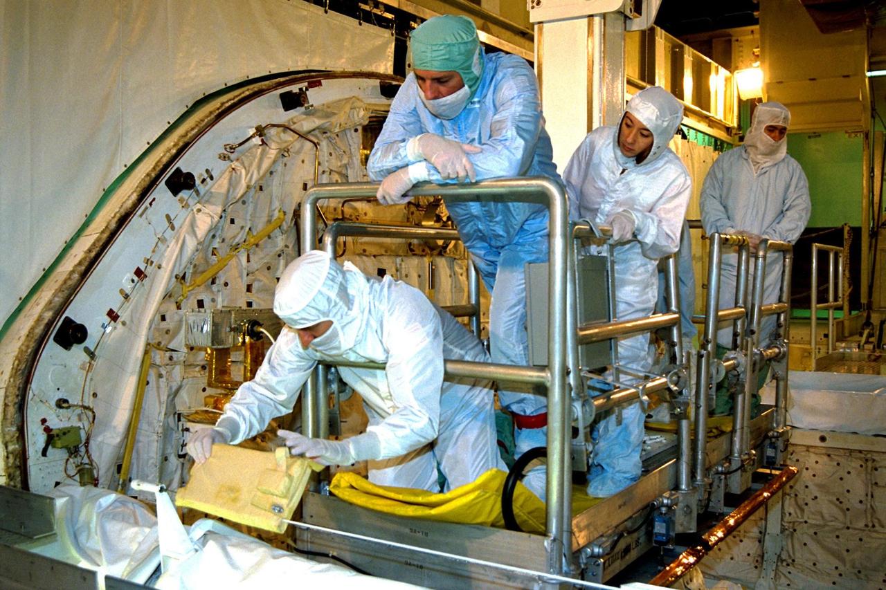 Members of the STS-90 crew participate in the Crew Equipment Interface Test (CEIT) in Kennedy Space Center's Orbiter Processing Facility Bay 3. The CEIT gives astronauts an opportunity to get a hands-on look at the payloads with which they will be working on-orbit. Investigations during the STS-90 Neurolab mission will focus on the effects of microgravity on the nervous system. Specifically, experiments will study the adaptation of the vestibular system, the central nervous system, and the pathways that control the ability to sense location in the absence of gravity, as well as the effect of microgravity on a developing nervous system. The crew of STS-90, slated for launch in April, will include Commander Richard Searfoss, Pilot Scott Altman, Mission Specialists Richard Linnehan, Dafydd (Dave) Williams, M.D., and Kathryn (Kay) Hire, and Payload Specialists Jay Buckey, M.D., and James Pawelczyk, Ph.D