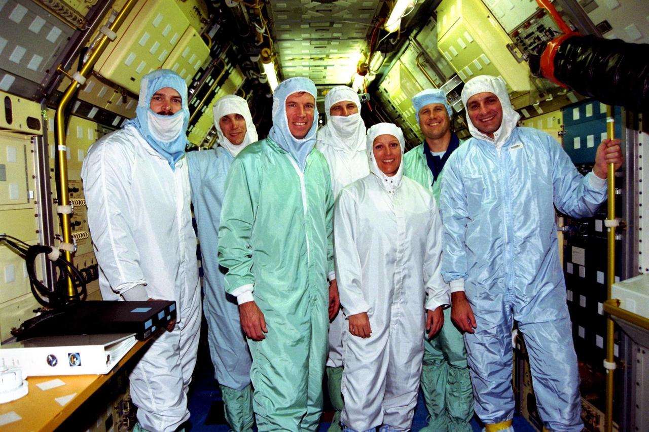 Members of the STS-90 crew participate in the Crew Equipment Interface Test (CEIT) in Kennedy Space Center's Orbiter Processing Facility Bay 3. The CEIT gives astronauts an opportunity to get a hands-on look at the payloads with which they will be working on-orbit. Investigations during the STS-90 Neurolab mission will focus on the effects of microgravity on the nervous system. Specifically, experiments will study the adaptation of the vestibular system, the central nervous system, and the pathways that control the ability to sense location in the absence of gravity, as well as the effect of microgravity on a developing nervous system. The crew of STS-90, slated for launch in April, are, left to right, Pilot Scott Altman; Payload Specialist James Pawelczyk, Ph.D.; Commander Richard Searfoss; Mission Specialists Dafydd (Dave) Williams, M.D., and Kathryn (Kay) Hire; Payload Specialist Jay Buckey, M.D.; and Mission Specialist Richard Linnehan