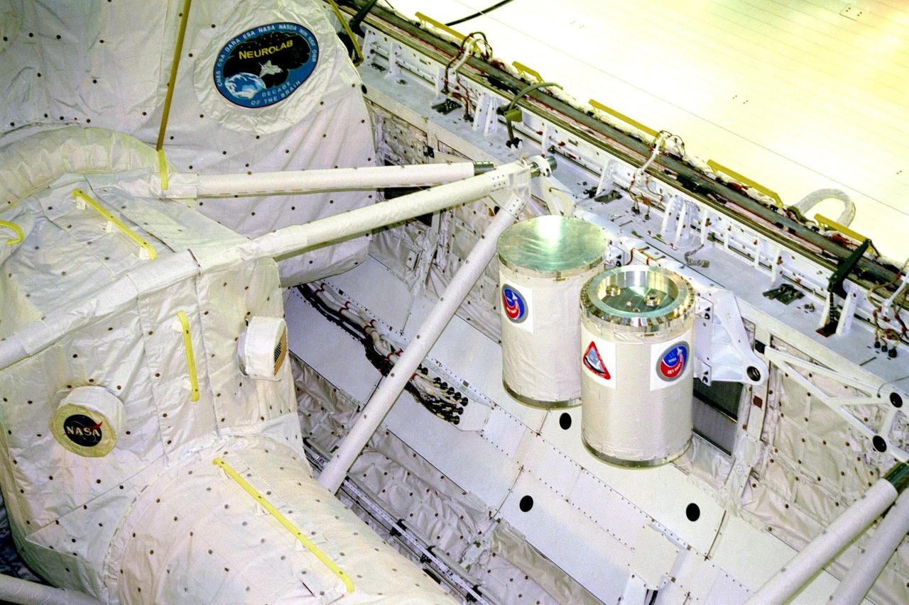 KENNEDY SPACE CENTER, FLA. -- The STS-90 Neurolab payload and two of the four Getaway Specials (GAS) await payload bay door closure in the orbiter Columbia today in Orbiter Processing Facility bay 3. Investigations during the Neurolab mission will focus on the effects of microgravity on the nervous system. The GAS container on the left contains the COLLisions Into Dust Experiment, or COLLIDE, which will study low velocity collisions between space-borne particles in an attempt to better understand planetary ring dynamics. The STS-90 mission is a joint venture of six space agencies and seven U.S. research agencies. Agencies participating in this mission include six institutes of the National Institutes of Health, the National Science Foundation, and the Office of Naval Research, as well as the space agencies of Canada, France, Germany, and Japan, and the European Space Agency (ESA)