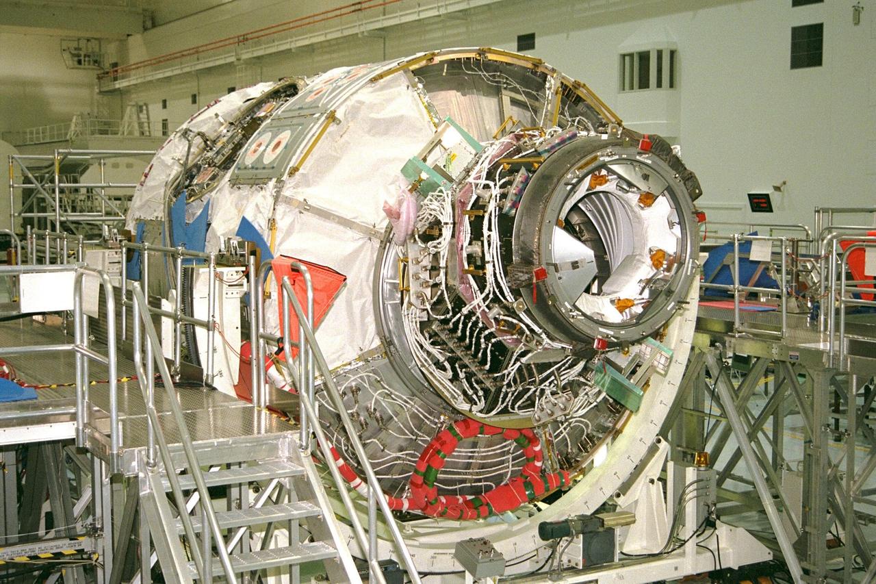 KENNEDY SPACE CENTER, FLA. -- Node 1, the first U.S. element for the International Space Station, and Pressurized Mating Adapter-1 (PMA-1) continue with prelaunch preparation activities at KSC's Space Station Processing Facility. The node and PMA-1 are seen here on a workstand getting ready to be moved the next day to a weight and balance stand for an interim weight and center of gravity determination. (The final determination is planned to be performed prior to transporting Node 1 to the launch pad.) Upon completing the interim determination, the node and PMA will be hoisted into the Shuttle payload transportation canister and the doors will be closed for a two-week leak check. Node 1 is a connecting passageway to the living and working areas of the space station. Node 1 is scheduled to fly on STS-88